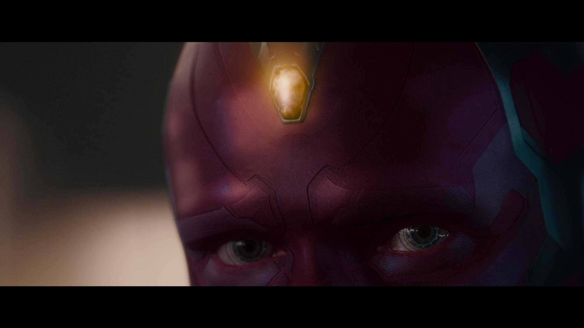 Mind Stone 桌布 壁紙 — Vision 發光的前額和強烈眼神在昏暗燈光下的特寫。