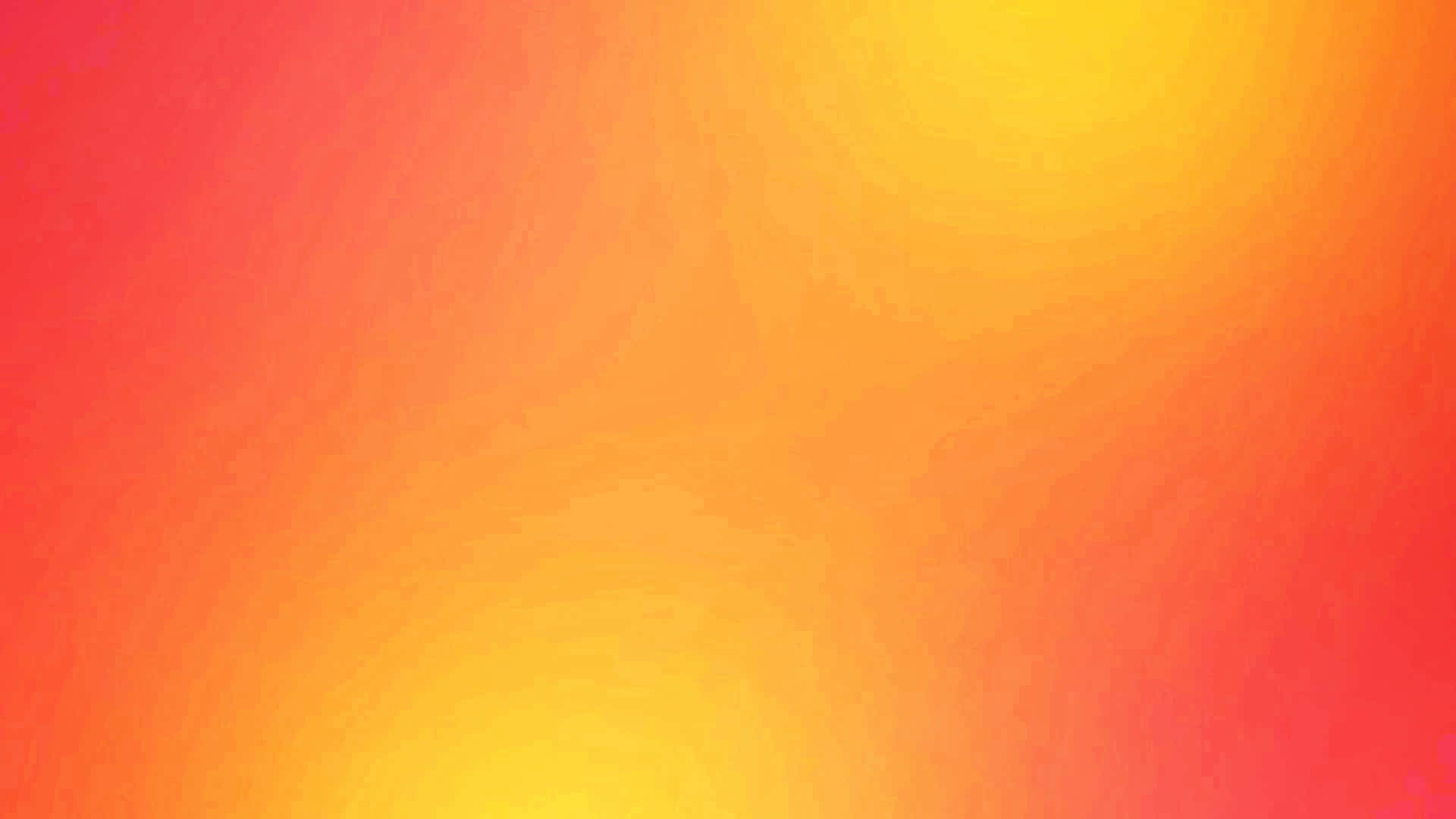  壁紙 — 溫暖的紅色和黃色像日出般柔和地融合在畫布上的燦爛漸變。