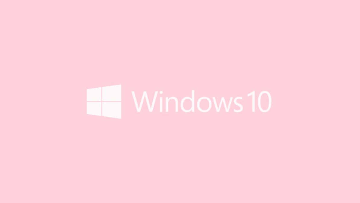 Soft Pink 桌布 壁紙 — Windows 10 標誌以白色文字和圖示居中顯示在純色粉彩粉紅色背景上。