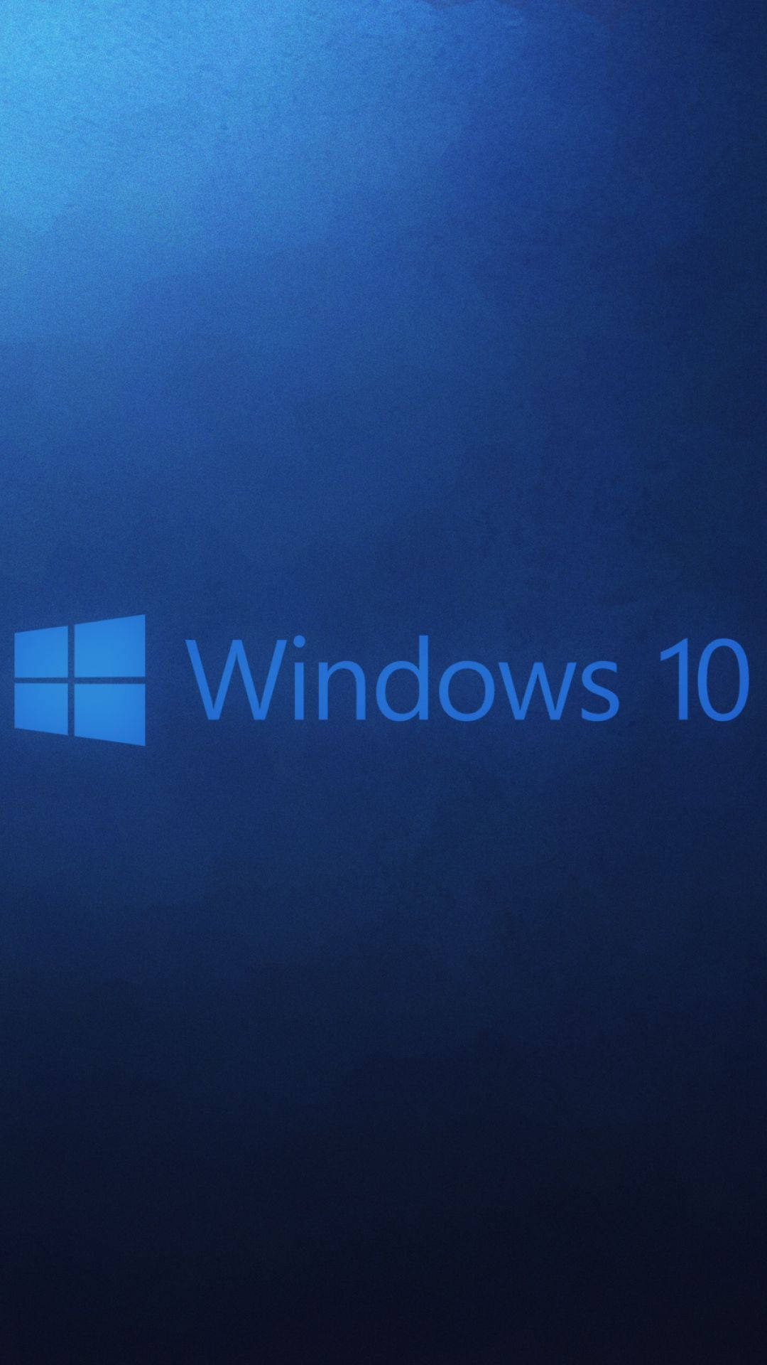 Windows 10 桌布 壁紙 — Windows 10 標誌在帶有細微紋理的漸變藍色背景上柔和發光。