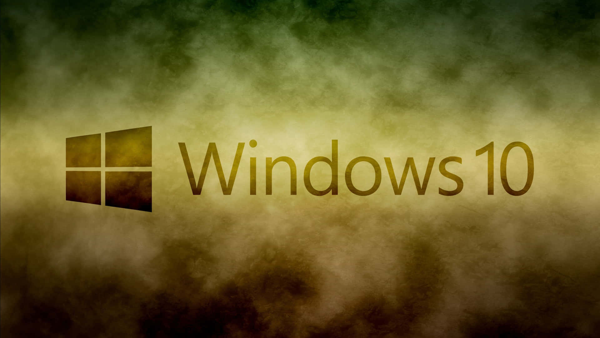 Windows 10 桌布 壁紙 — Windows 10 標誌在金色和深綠色的煙霧漸變背景上溫暖地發光。