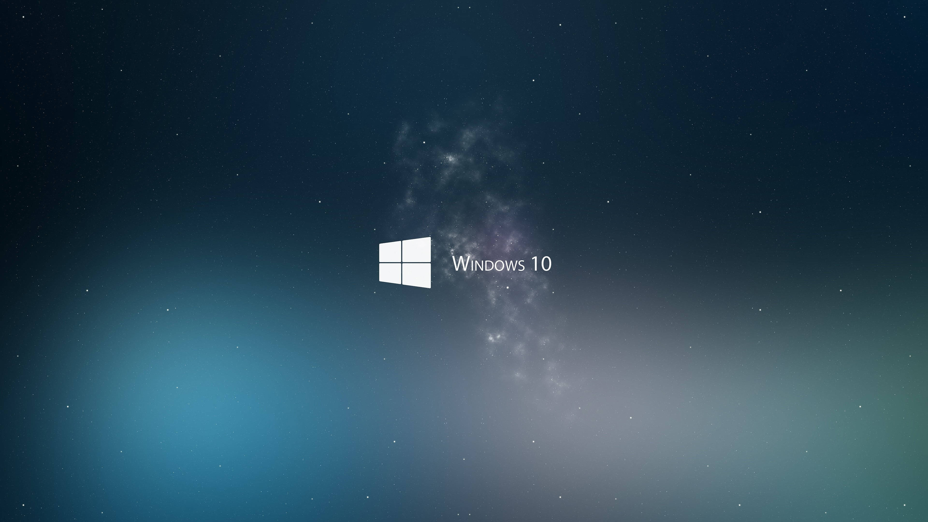 Dark Windows 桌布 壁紙 — Windows 10 標誌居中對齊，背景為星空宇宙，帶有藍色和紫色漸層。