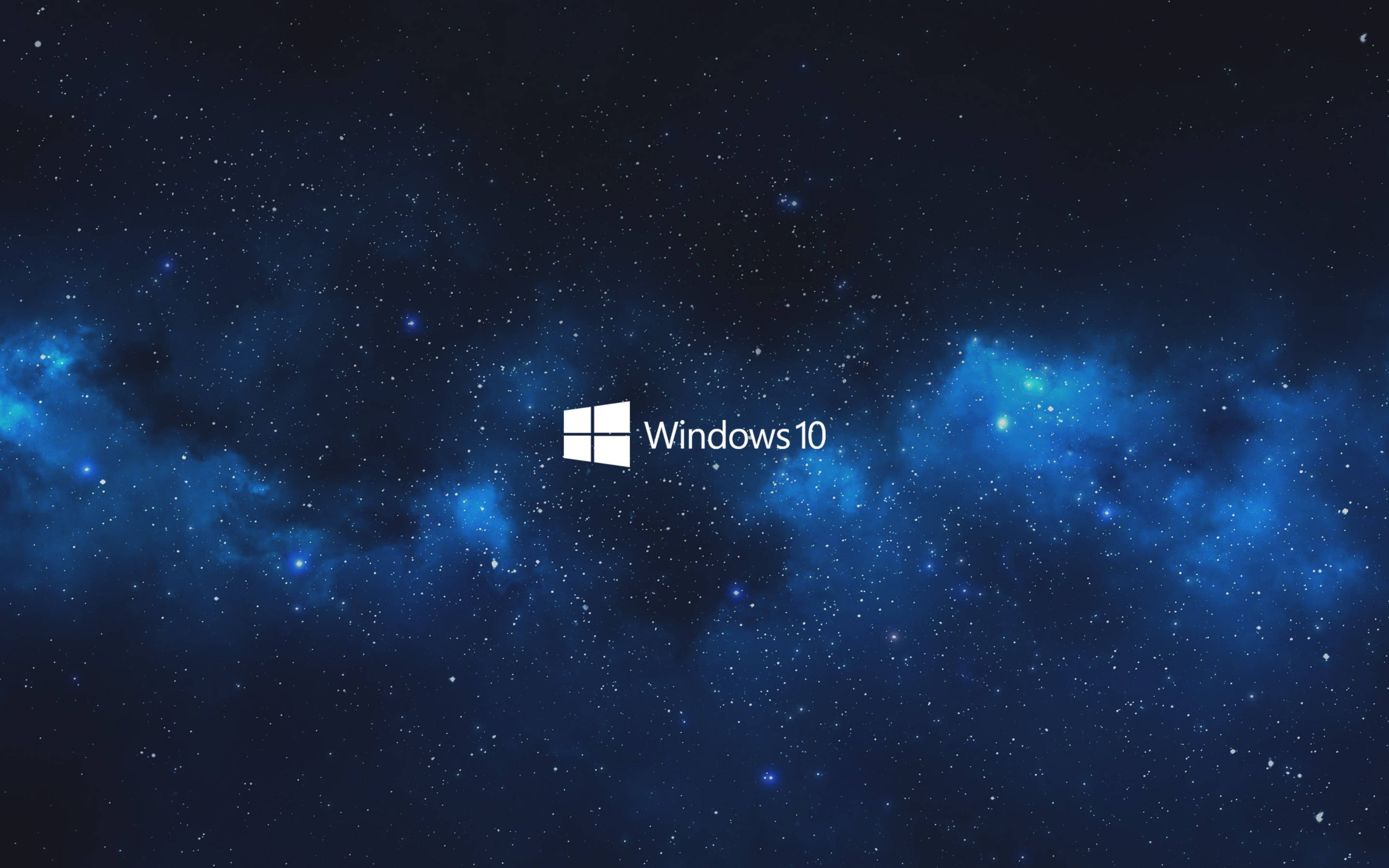 Windows 10 桌布 壁紙 — Windows 10 標誌居中於深藍色宇宙背景，帶有發光的星雲和散落的星星。
