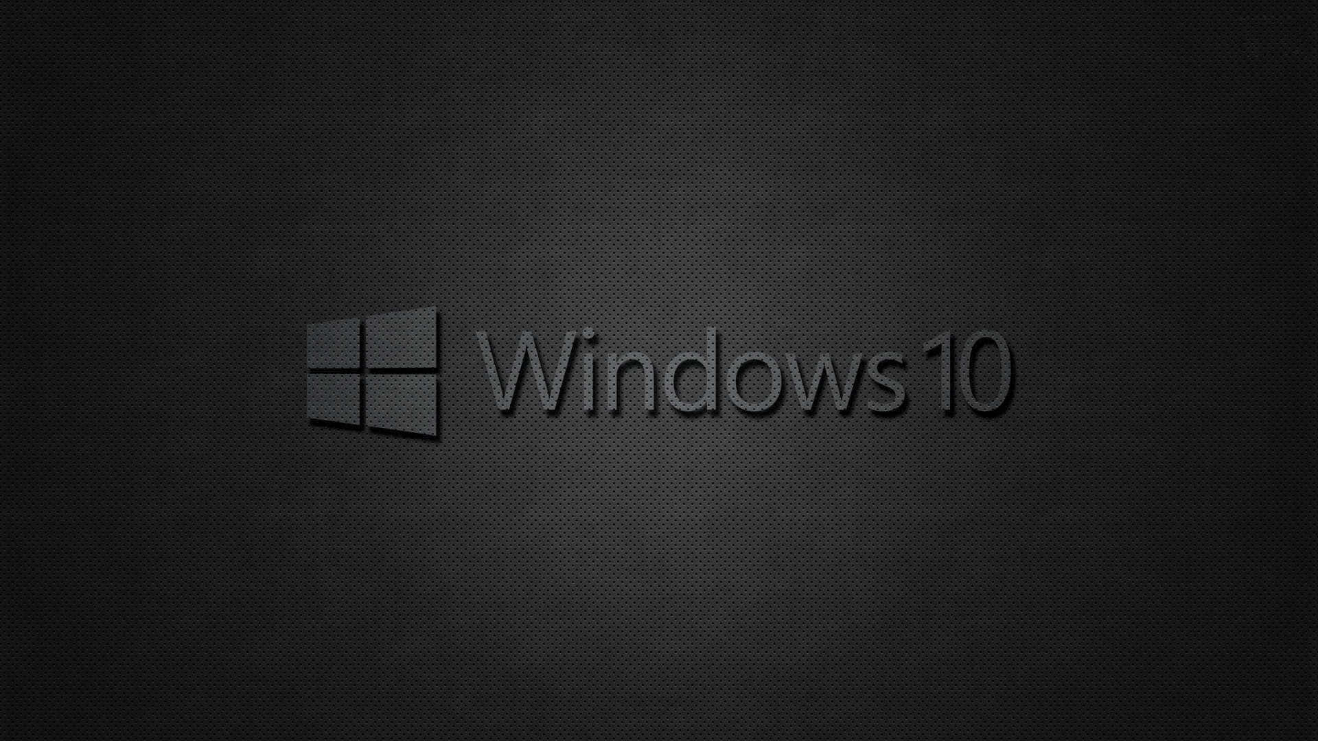 Black Windows 桌布 壁紙 — Windows 10 標誌居中於帶有微妙漸變照明的深色紋理背景上。