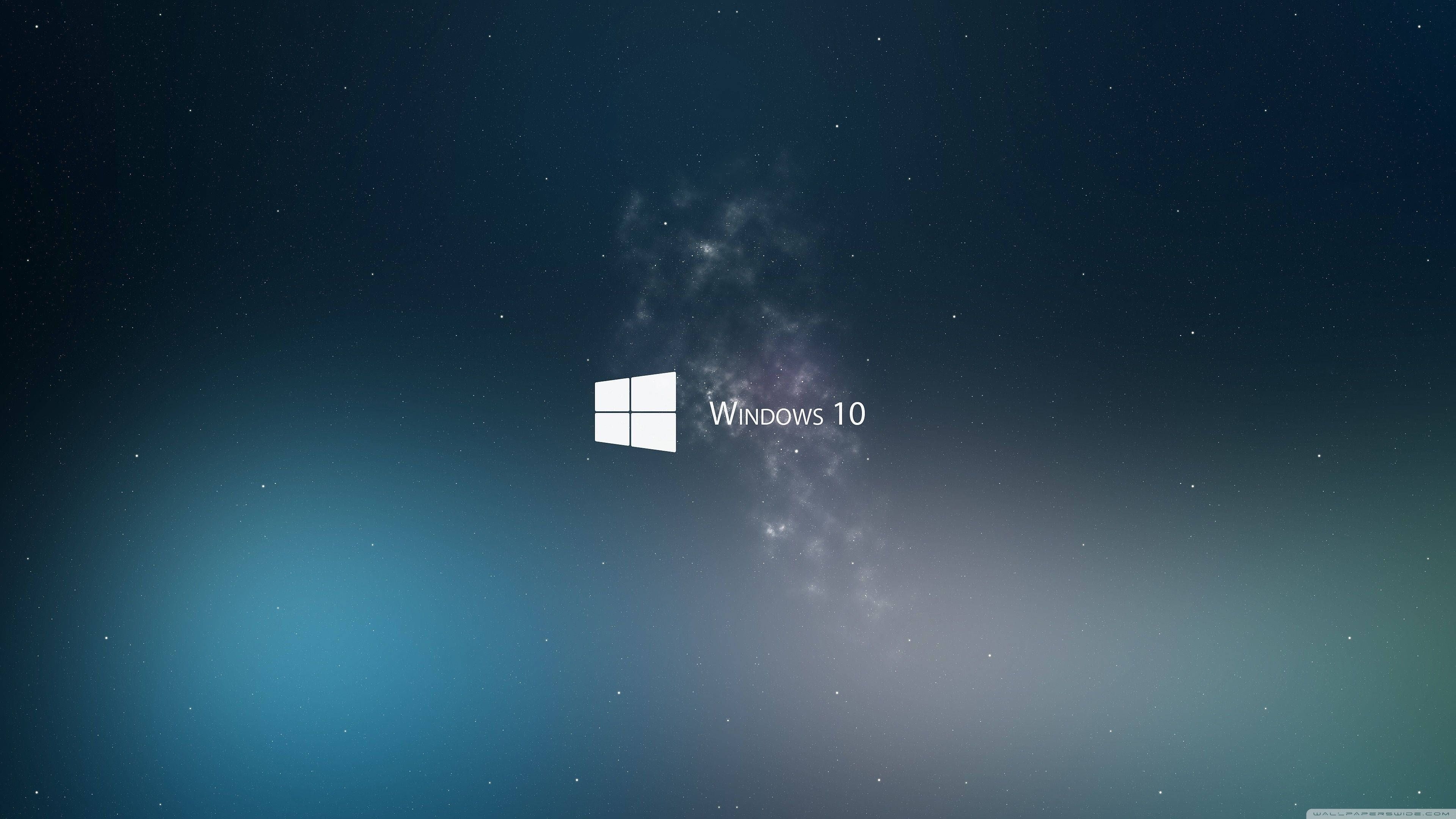 Windows 桌布 壁紙 — Windows 10 標誌置中於星空宇宙背景，帶有星雲和漸變藍色。