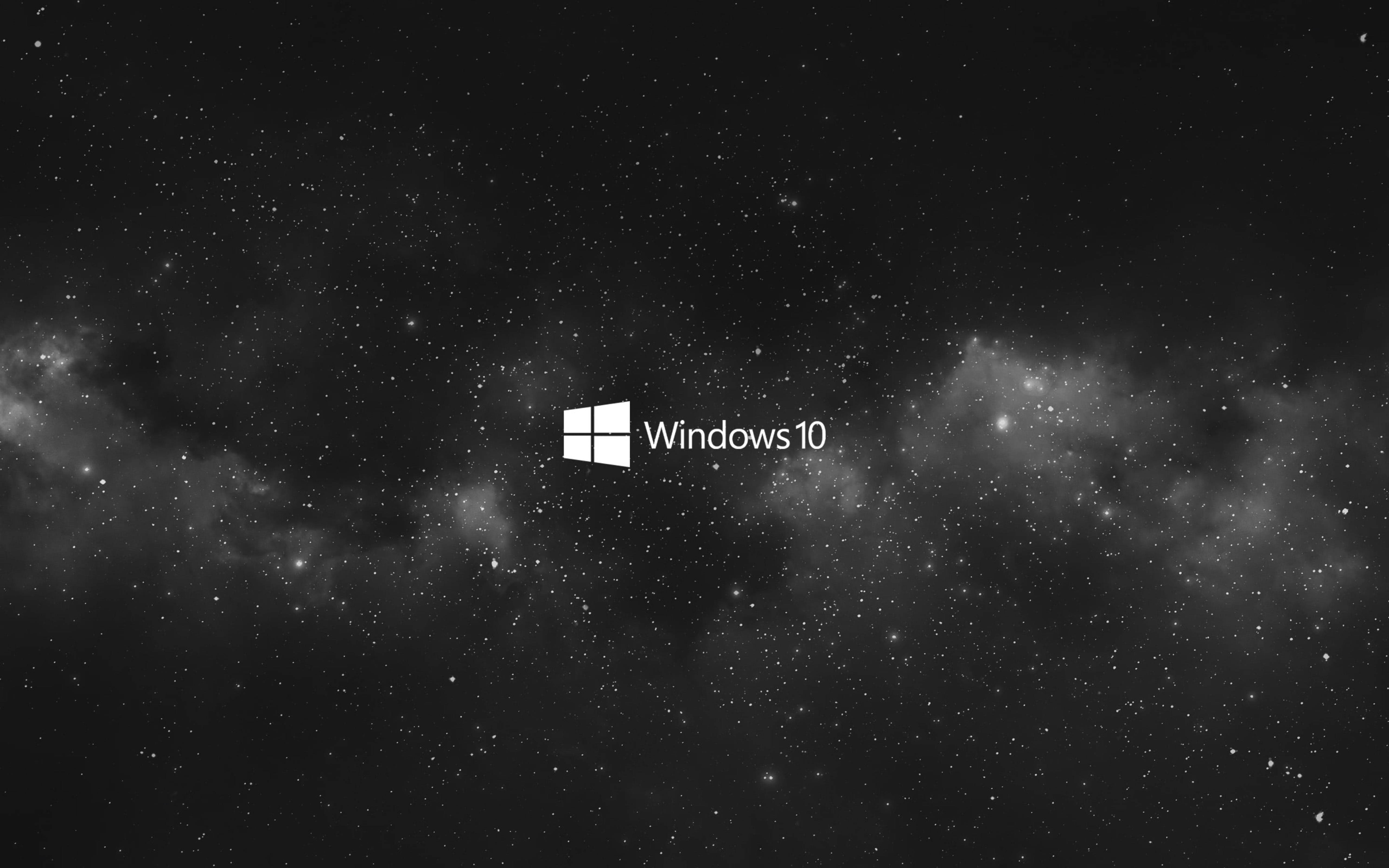 Windows 10 桌布 壁紙 — Windows 10 標誌置中於星空宇宙背景，帶有星雲和黑暗太空。