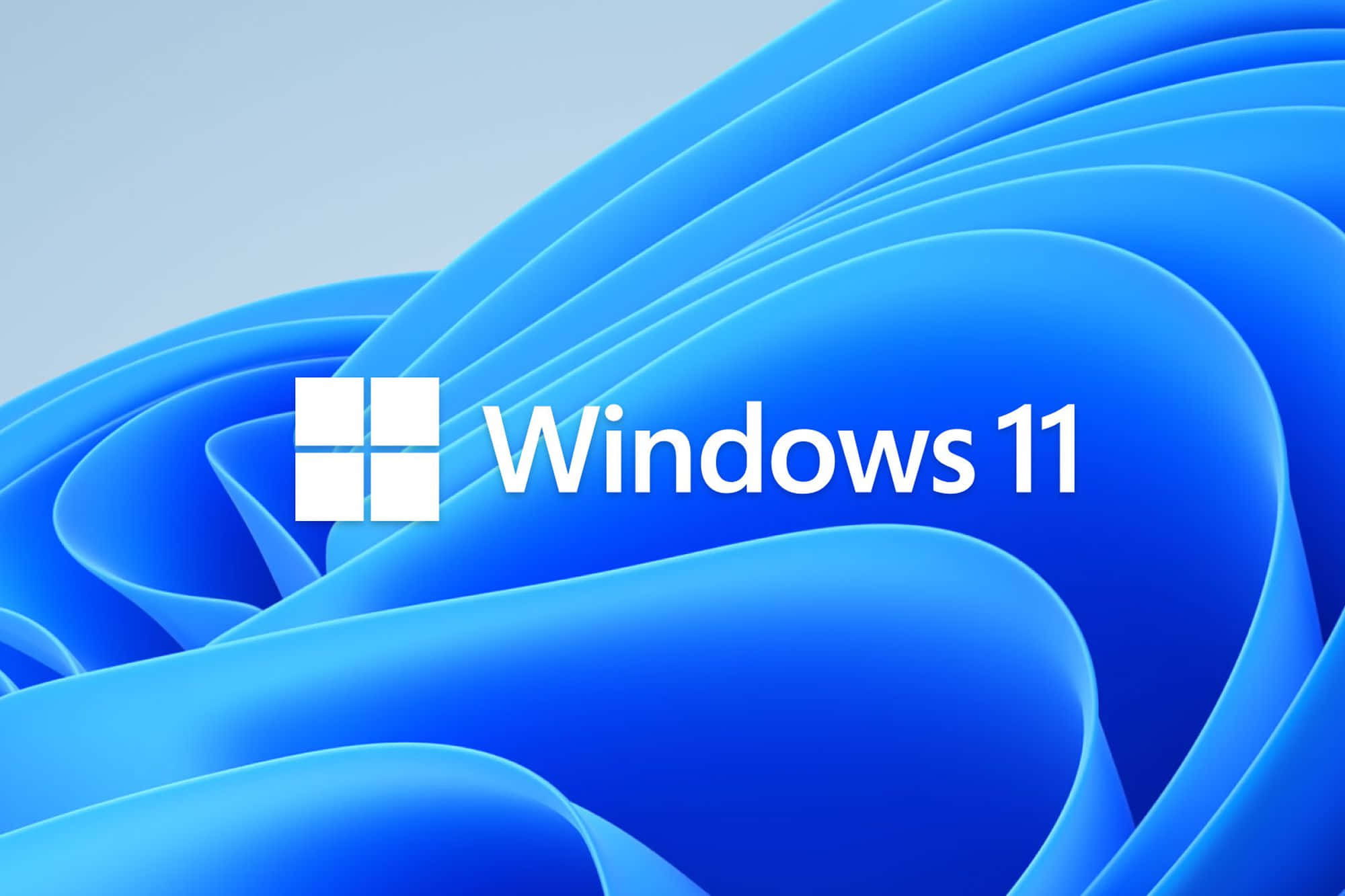 桌面 桌布 壁紙 — Windows 11 標誌居中於動態藍色波浪背景上，帶有柔和漸變。