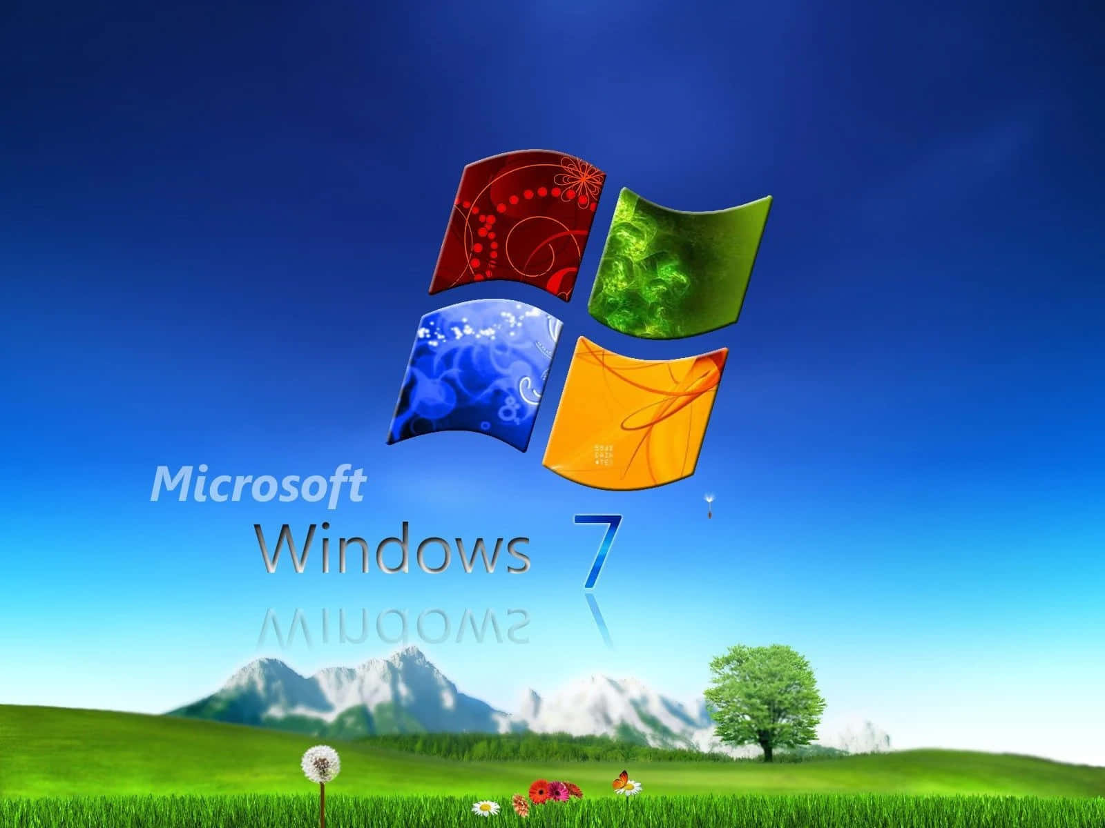 Windows 7 標誌懸浮在一個有山脈和樹木的草地上。 — Windows 7 壁紙