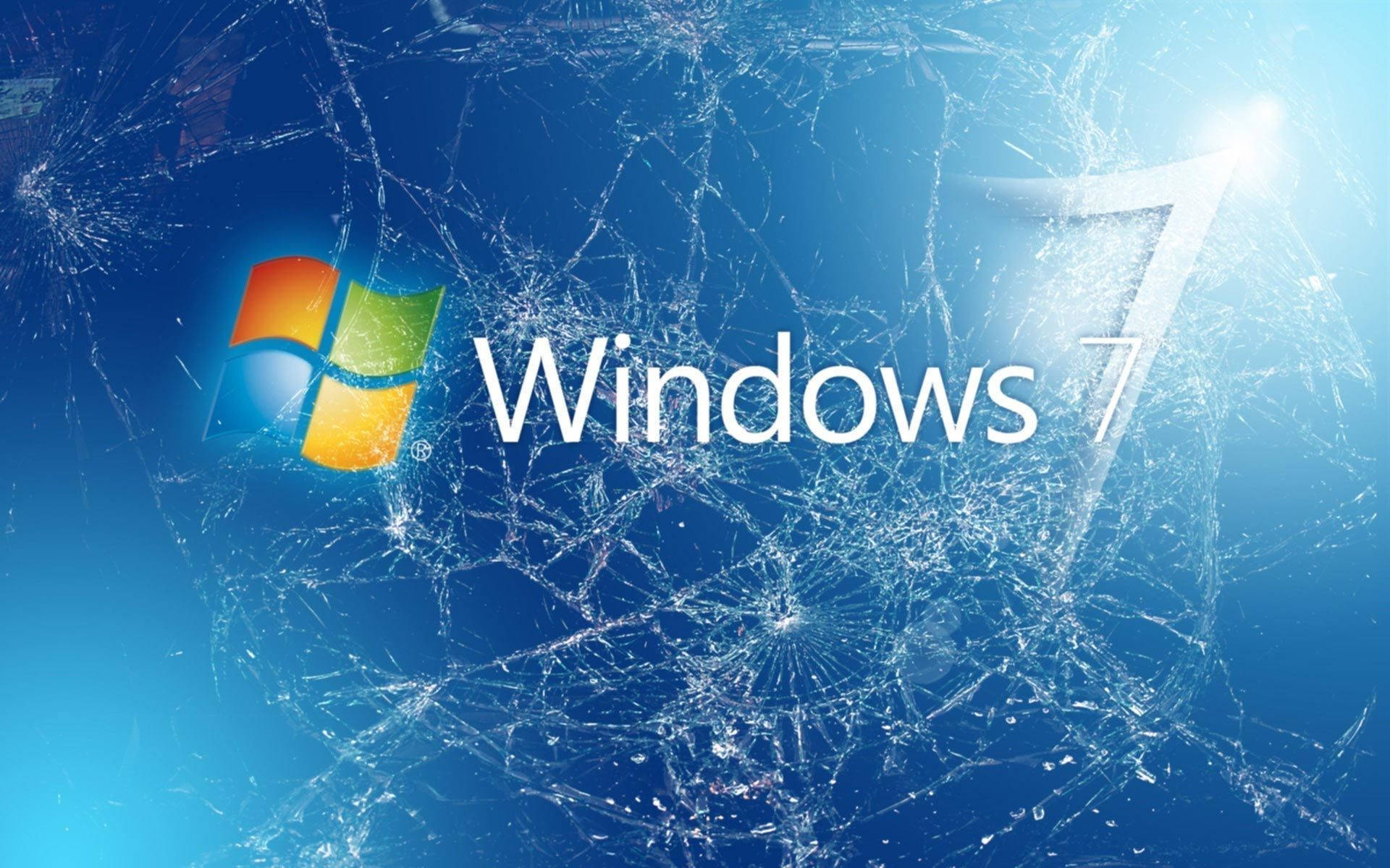 Computer Screen 桌布 壁紙 — Windows 7 標誌出現在破碎玻璃後面，帶有明亮的藍色漸變背景和發光光源。