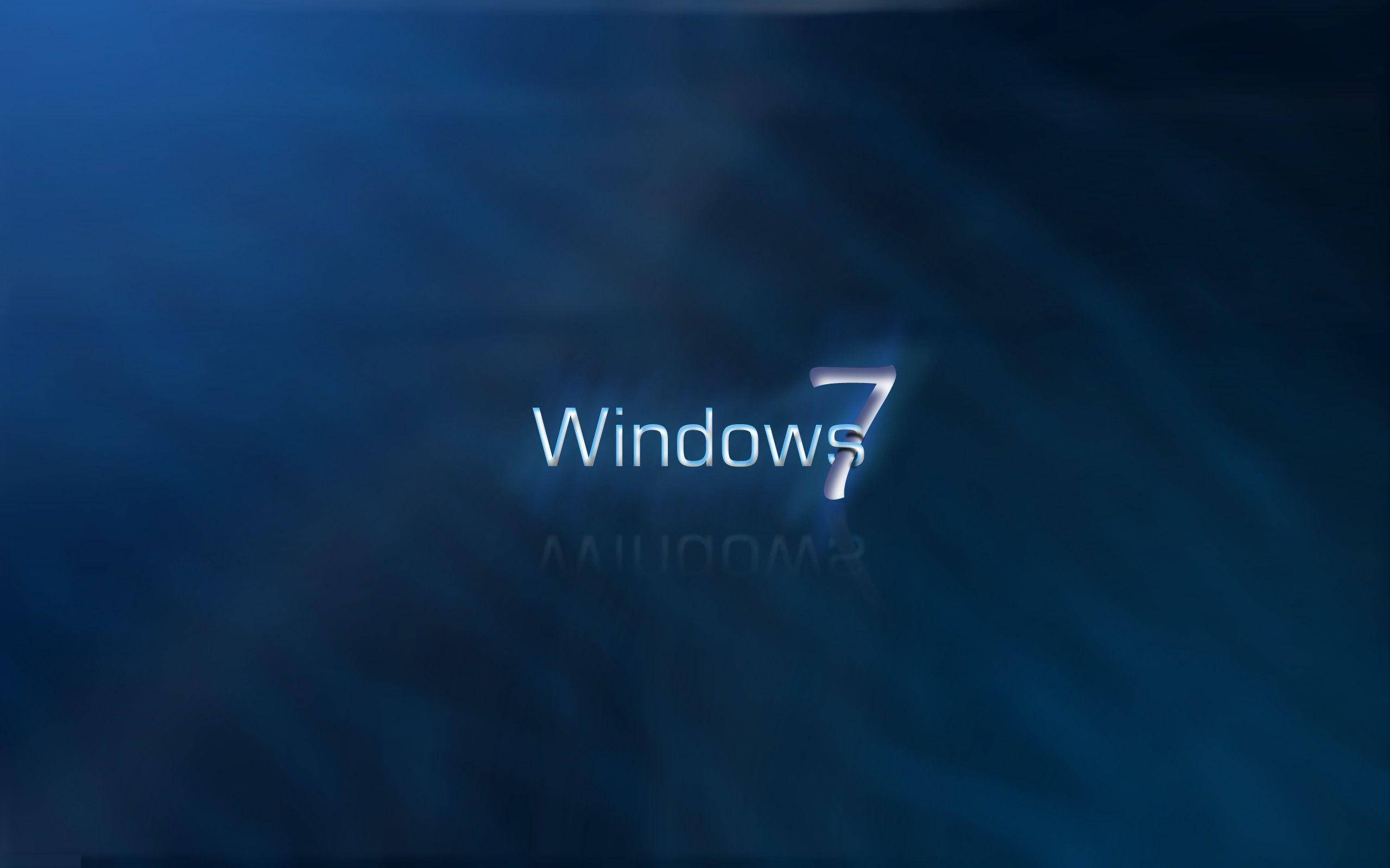 鎖屏 桌布 壁紙 — Windows 7 標誌在深藍色抽象背景上柔和發光，帶有微妙的光線。