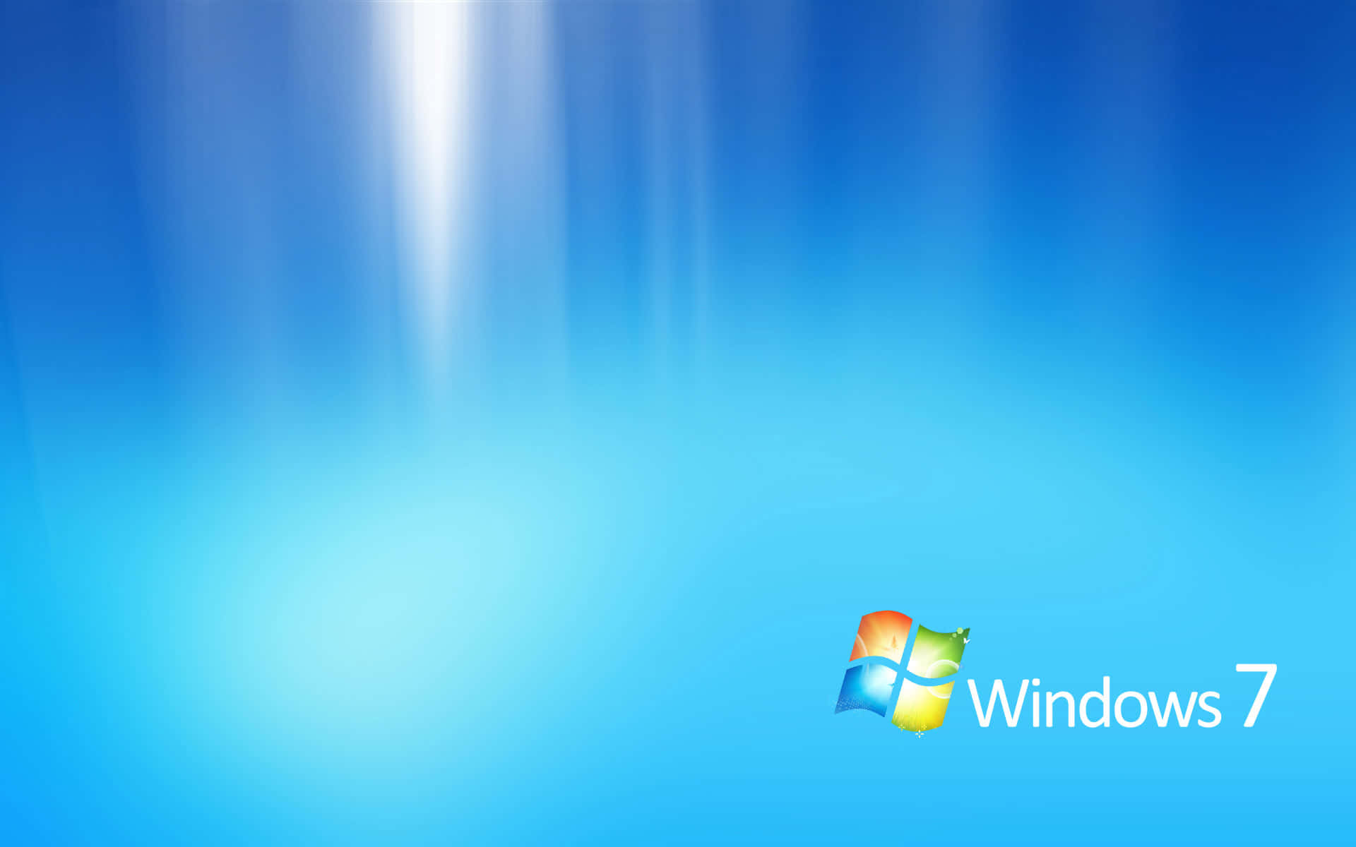 Windows 7 桌布 壁紙 — Windows 7 標誌在漸層藍色背景上柔和發光，並有從上方降下的光芒光束。