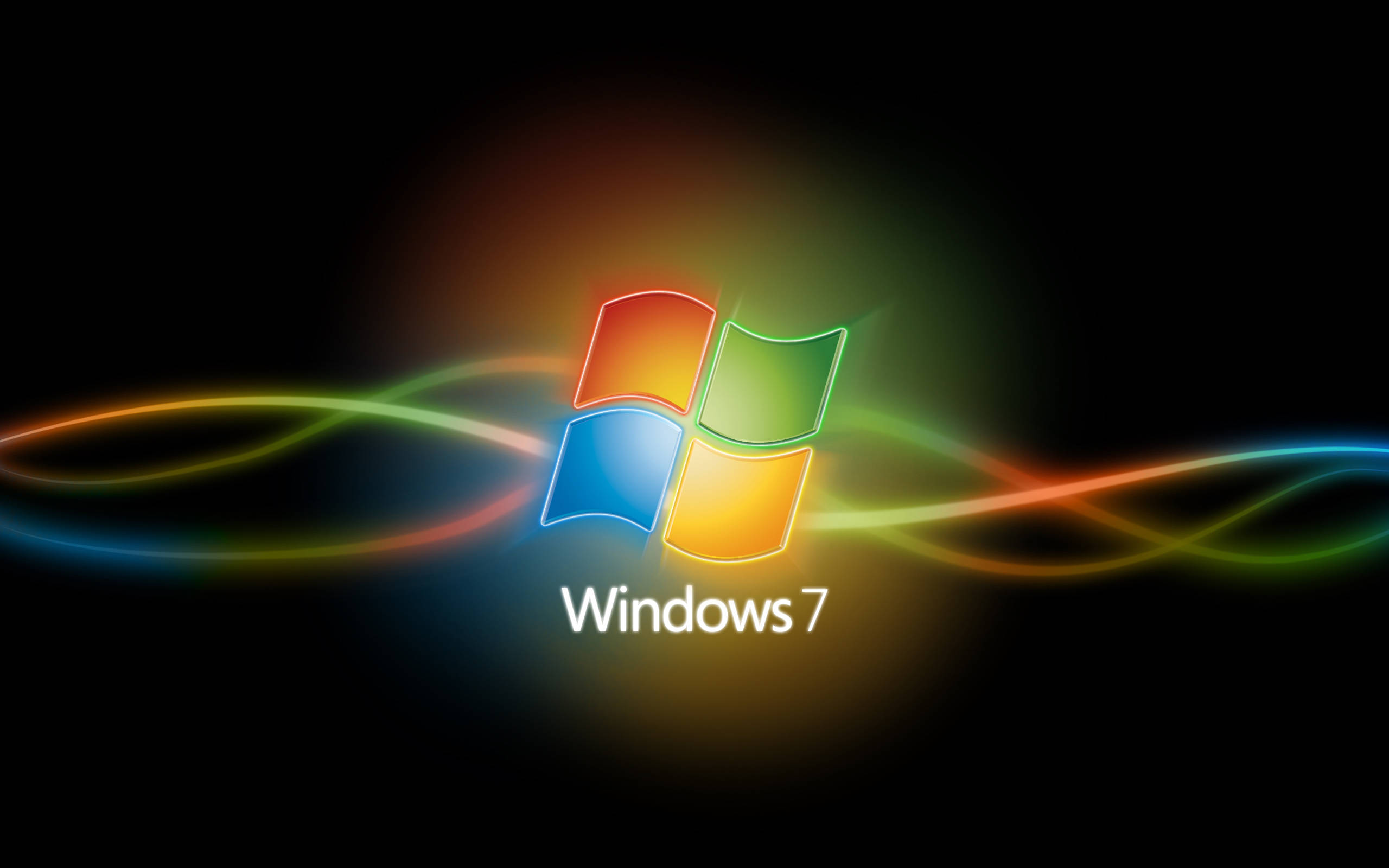 Windows 7 桌布 壁紙 — Windows 7 標誌在黑色背景上發出彩虹光軌。