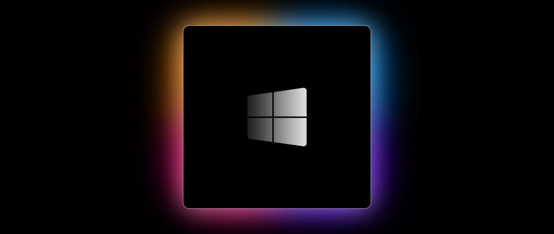  壁紙 — Windows 標誌居中於發光正方形內，帶有鮮豔彩虹光暈，背景為黑色。
