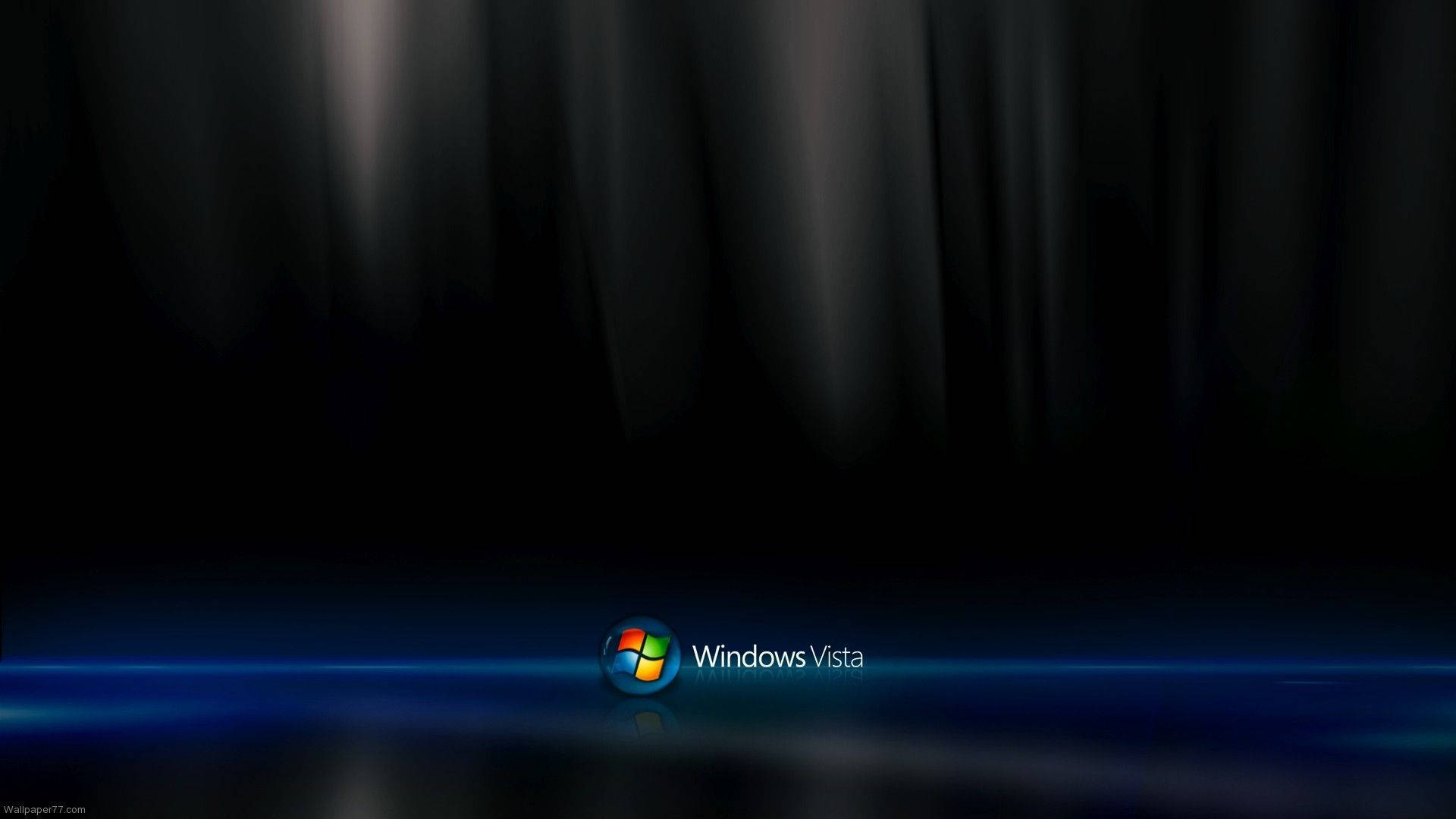 Vista 桌布 壁紙 — Windows Vista 標誌在類似窗簾的深色背景上發出藍光。
