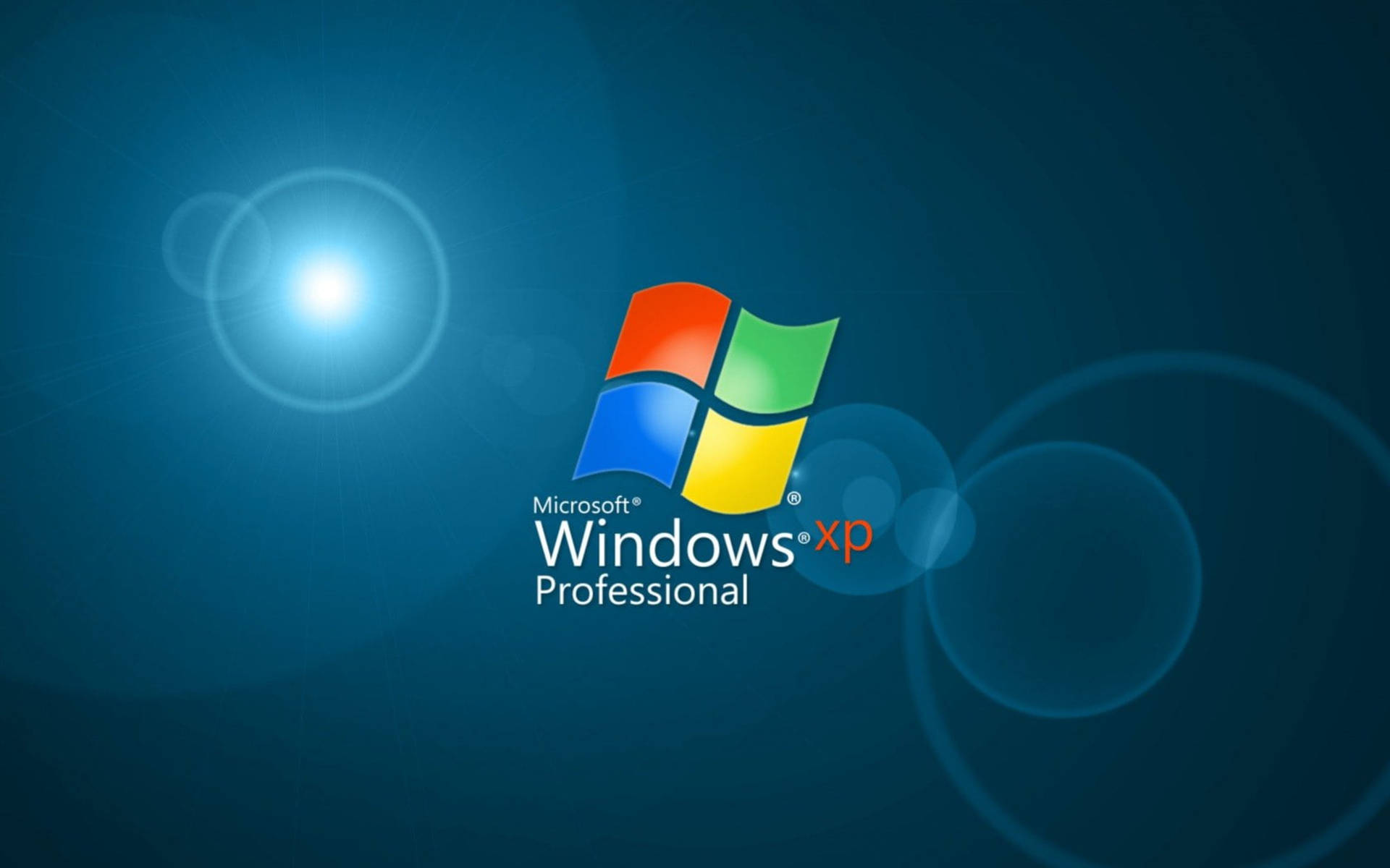 Windows XP Professional 標誌在藍色漸變背景上帶有鏡頭光暈
