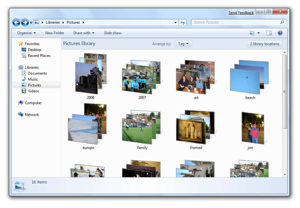 Windows 7 桌布 壁紙 — Windows 圖片庫視窗顯示 16 個縮圖資料夾，標籤為年份、藝術、海灘、歐洲、家庭、裱框、jon 及 2006 2007。