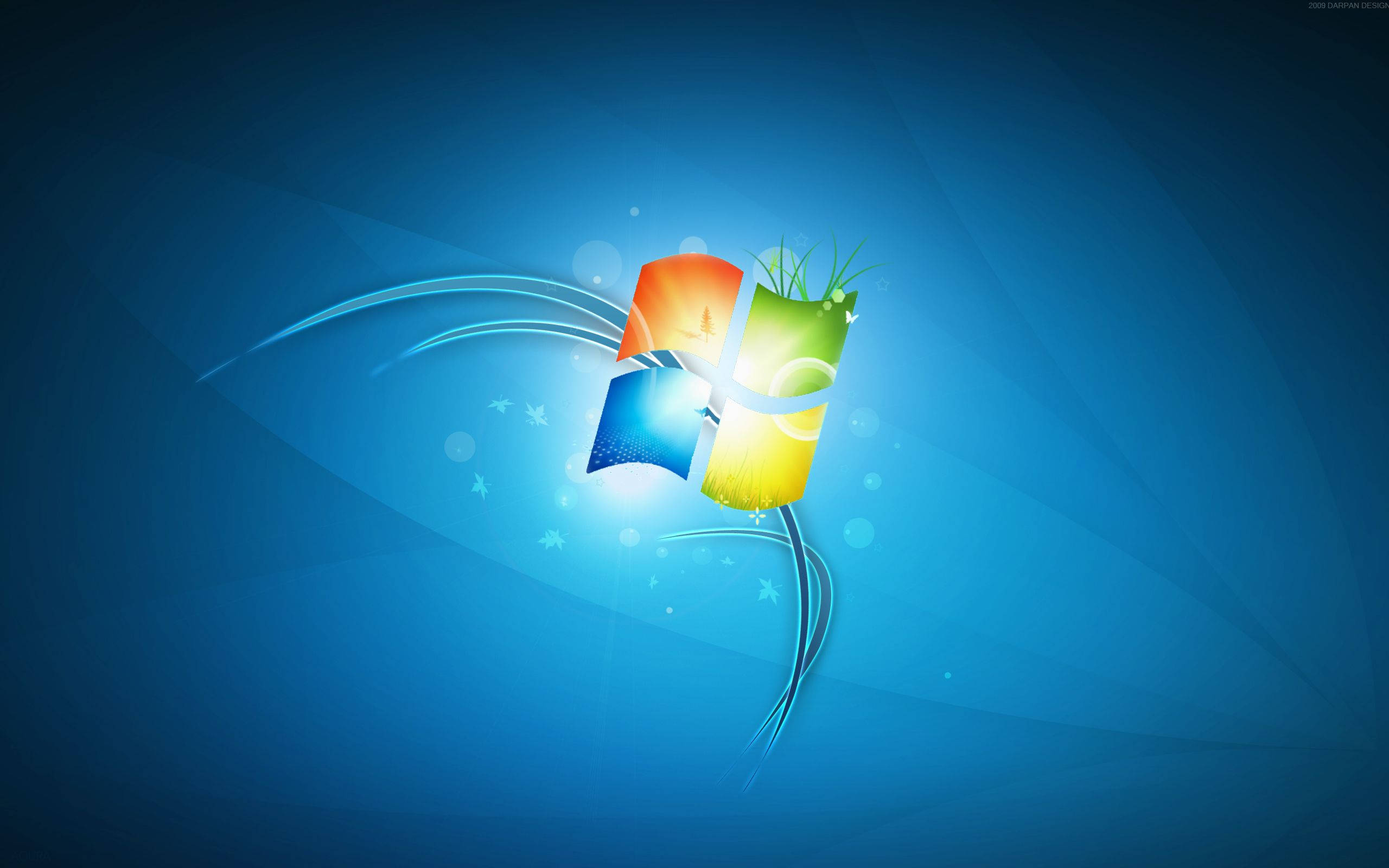 Windows 7 桌布 壁紙 — Windows 標誌，帶有鮮豔色彩的窗格和流動的光跡，背景為漸變藍色。
