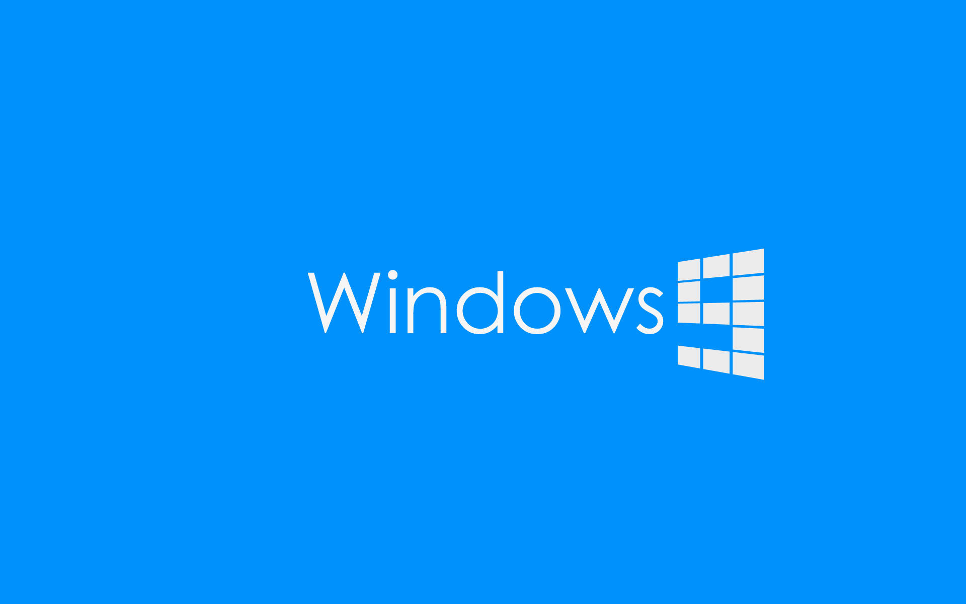 微軟桌面 桌布 壁紙 — Windows 標誌以白色文字和方塊圖示居中顯示在純藍色背景上。