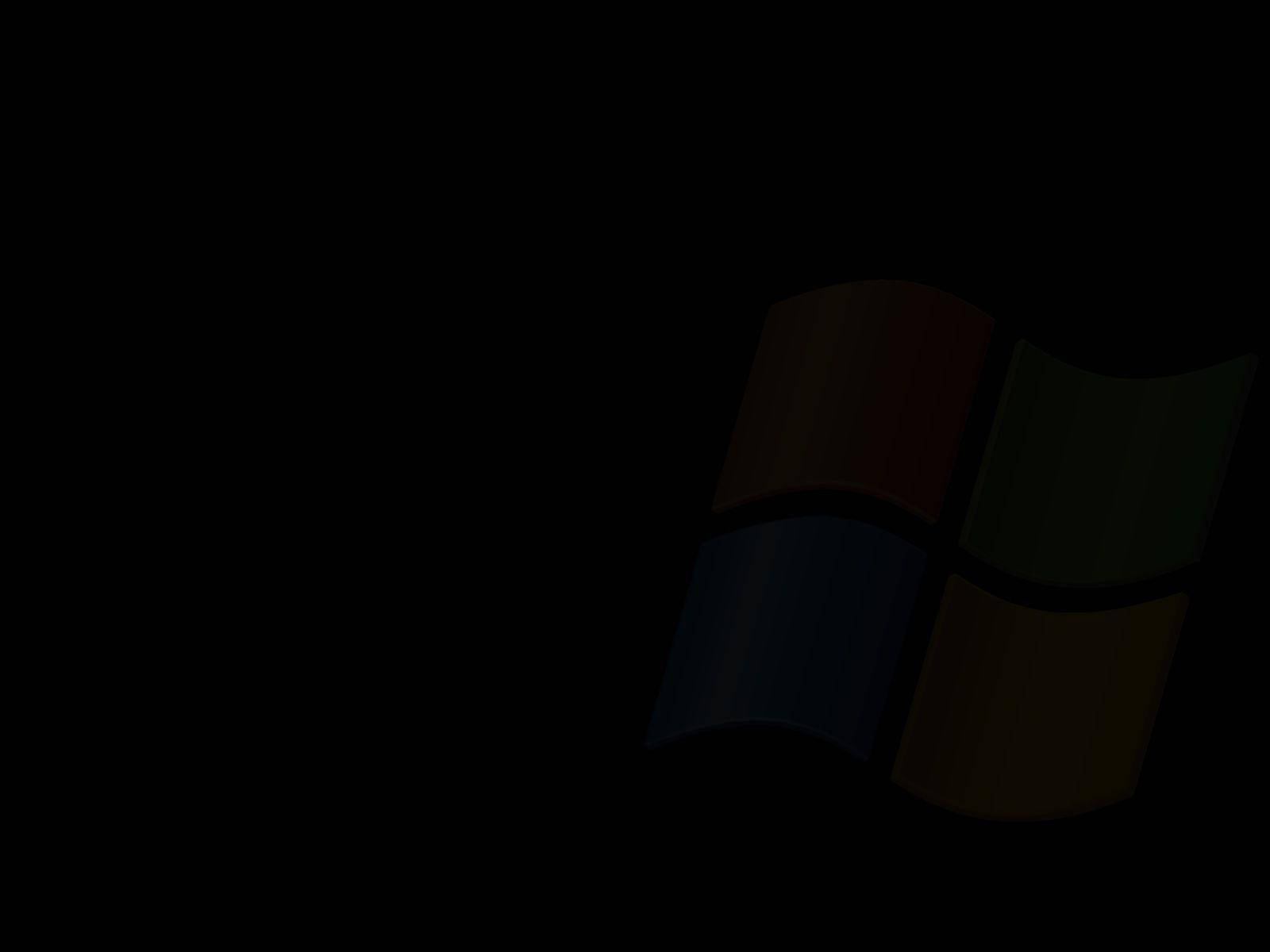 Solid 桌布 壁紙 — Windows 標誌在深色背景中隱約發光，帶有紅、綠、藍、黃色面板。