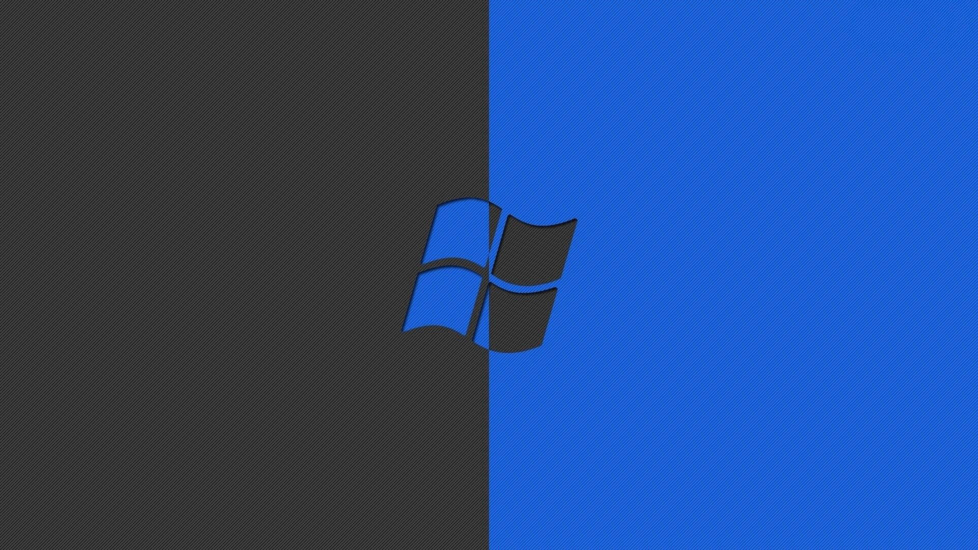 Windows 標誌在黑色和藍色分割背景上 — Microsoft 壁紙
