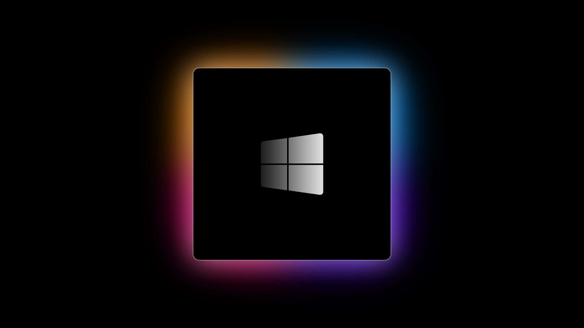Windows 標誌在黑色背景上帶有彩色發光光環 — Windows 10 GIF 壁紙