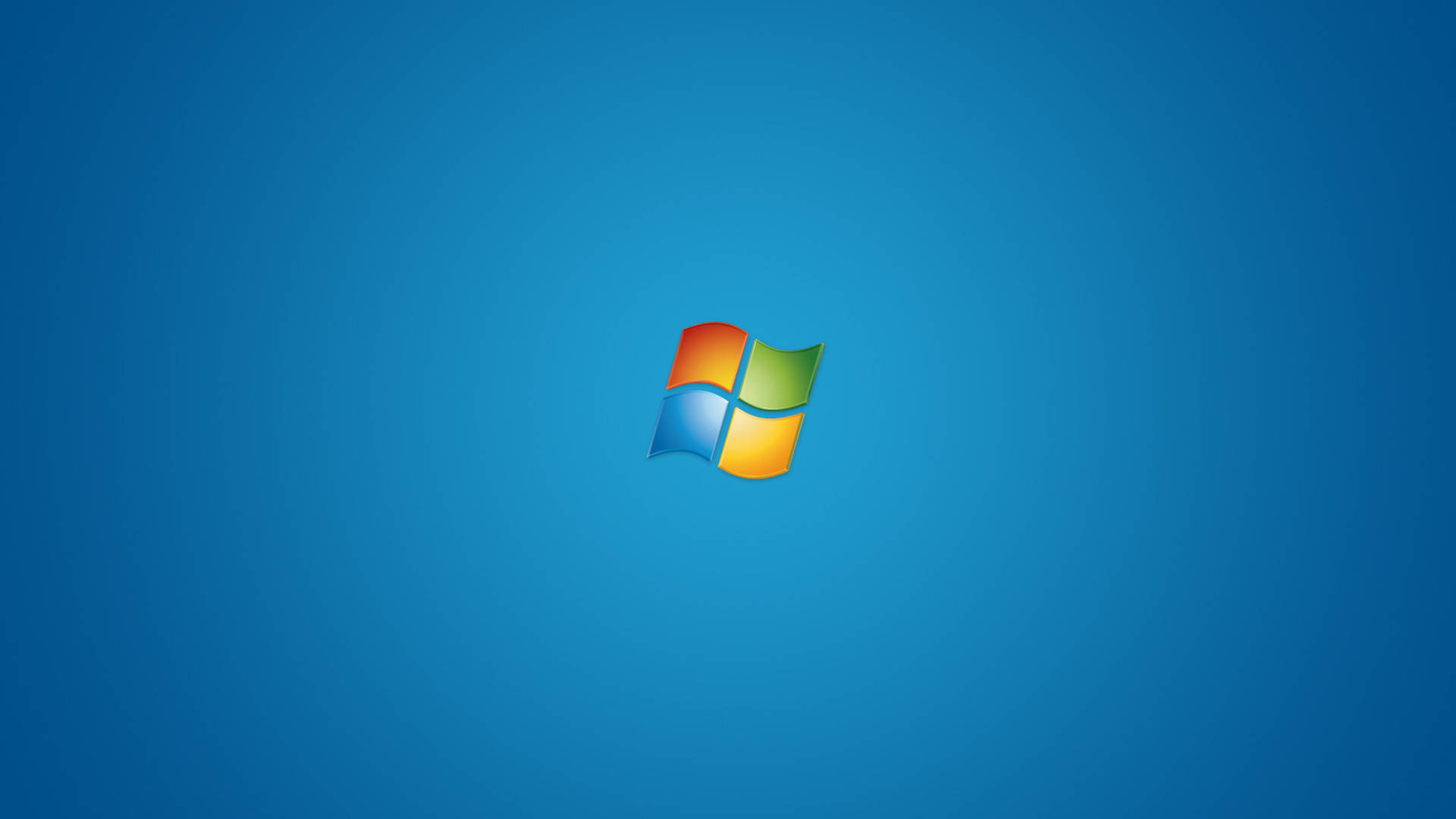 微軟桌面 桌布 壁紙 — Windows 標誌居中於純藍色漸變背景上。
