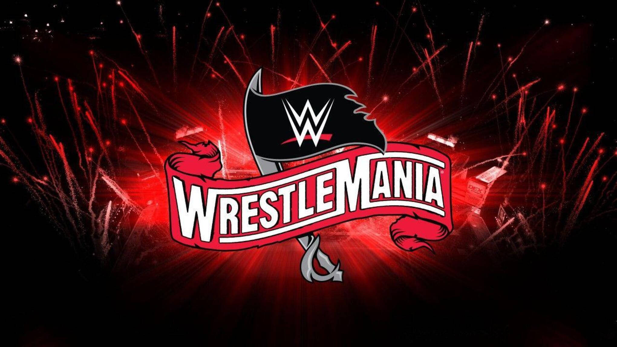 摔角 桌布 壁紙 — WrestleMania 標誌在黑色背景上爆發出紅色煙火，特色是帶有白色 WWE 標誌和紅色拳頭的黑色旗幟。