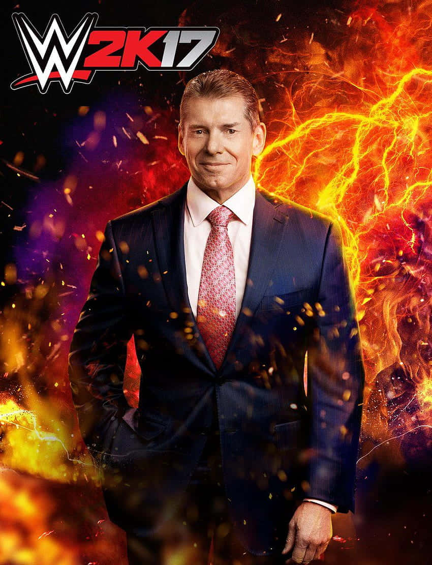 電玩遊戲 桌布 壁紙 — WWE CEO Vince McMahon 自信地穿著西裝站在火熱的電氣背景前，火花四濺。