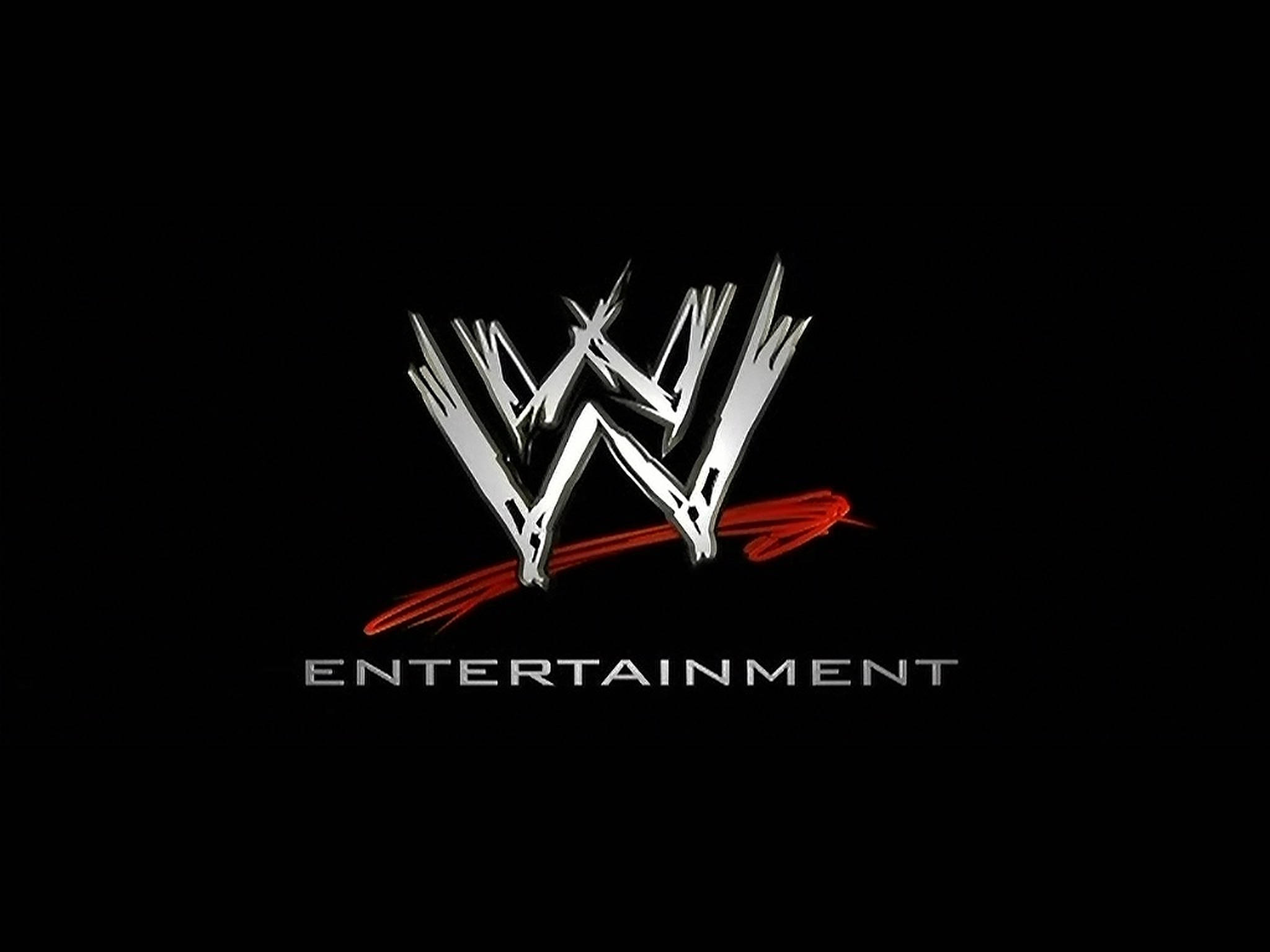 WWE 桌布 壁紙 — WWE Entertainment 標誌在純黑色背景上閃耀著金屬銀色，並帶有醒目的紅色條紋。