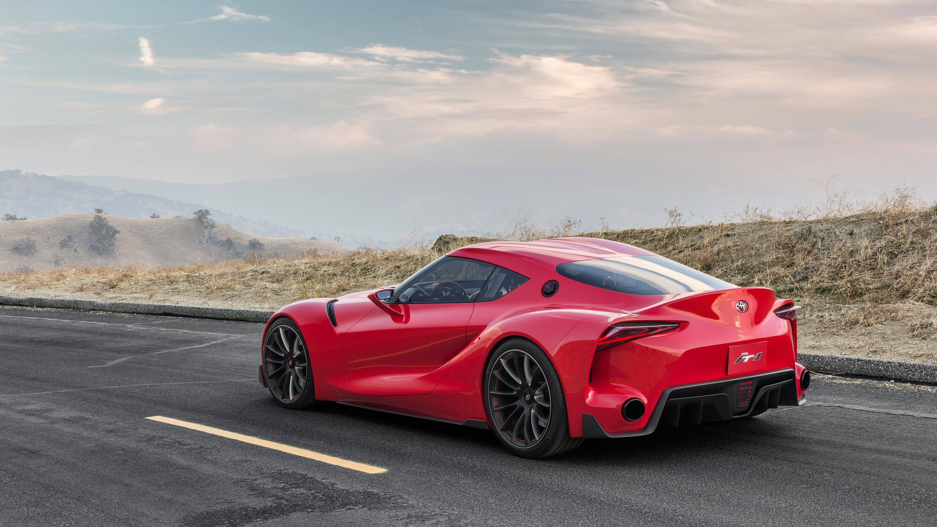 日落時分山路上紅色跑車 — Toyota Supra 壁紙