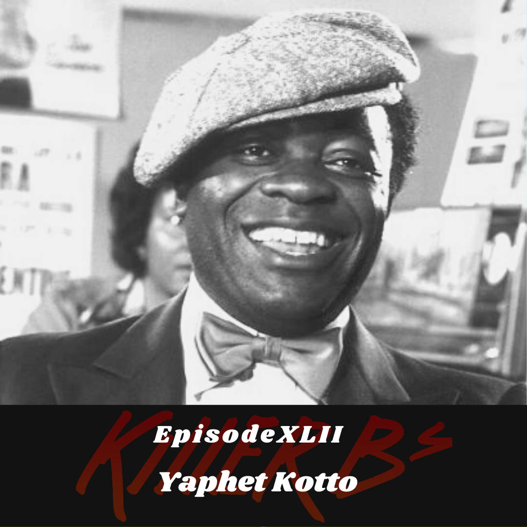 actor 桌布 壁紙 — Yaphet Kotto 戴著平頂帽和領結，露出燦爛笑容的歡樂黑白肖像。