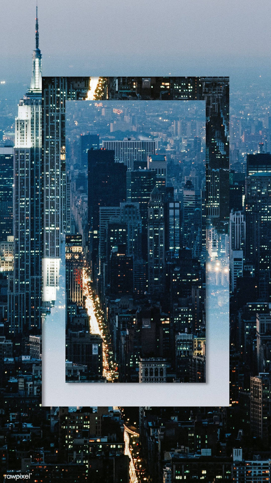 帶框的紐約市摩天大樓和發光街道的夜景。 — iPhone X 壁紙