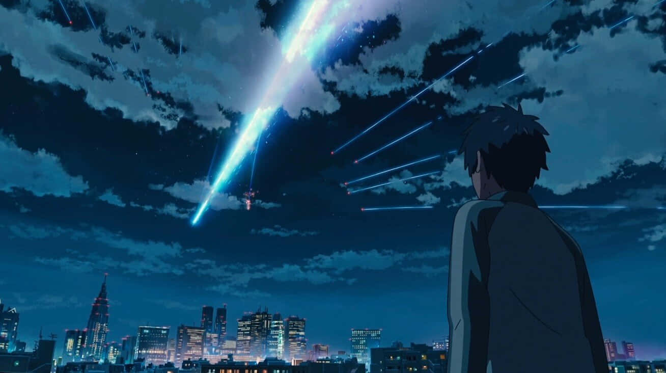  壁紙 — 一個孤獨的身影凝視著一場耀眼的流星雨劃過發光城市景觀上方的星空夜空。