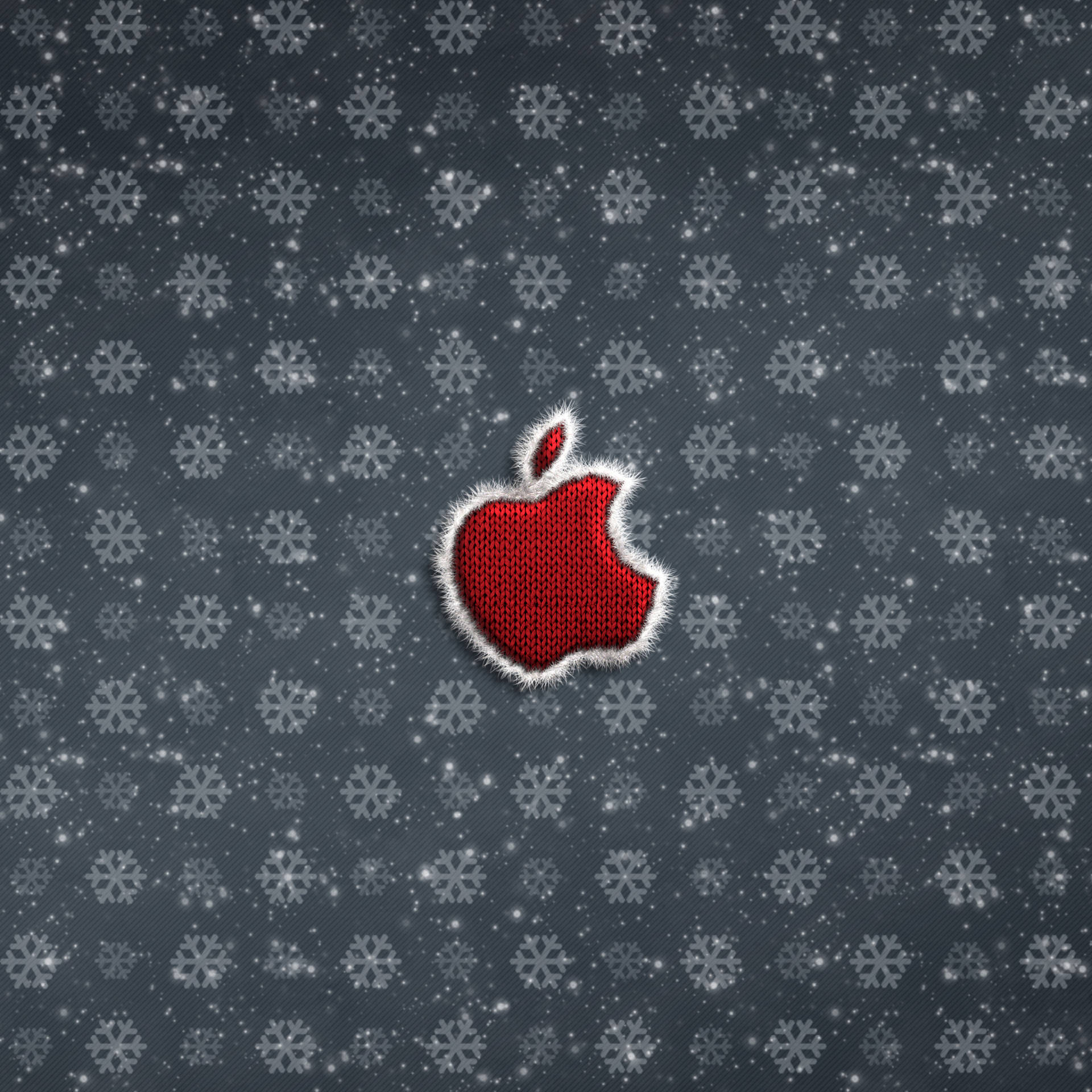 紅色編織Apple標誌，帶白色流蘇，在雪灰色背景上。 — 4K 壁紙