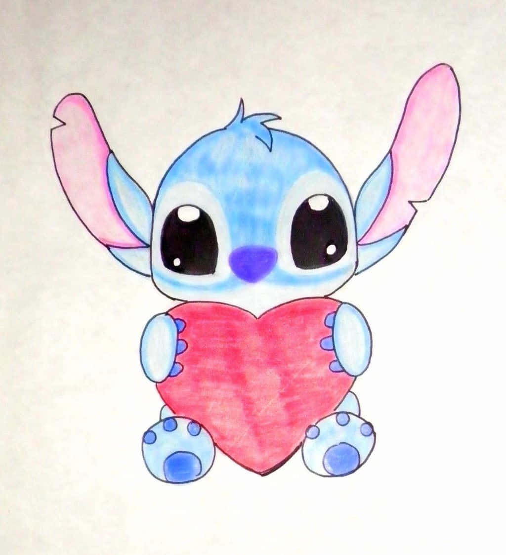 藍色外星人以手繪卡通風格拿著一顆紅心。 — Stitch 壁紙