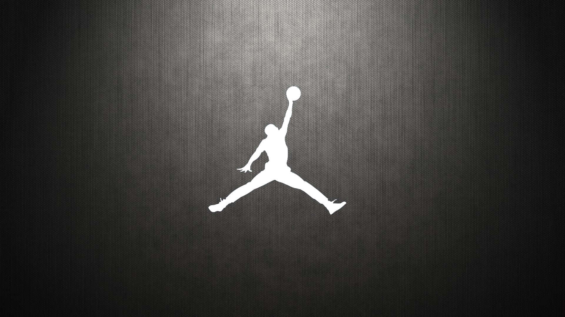 白色Jordan標誌剪影，在深色紋理背景上帶有光線。 — Jordan 壁紙