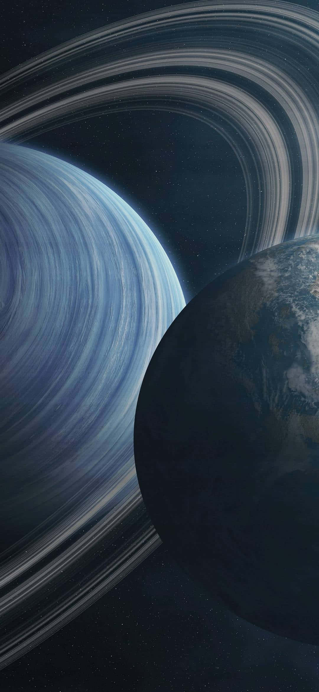 兩顆行星，一顆帶有光環，漂浮在星空中 — iPhone 13 Pro 壁紙