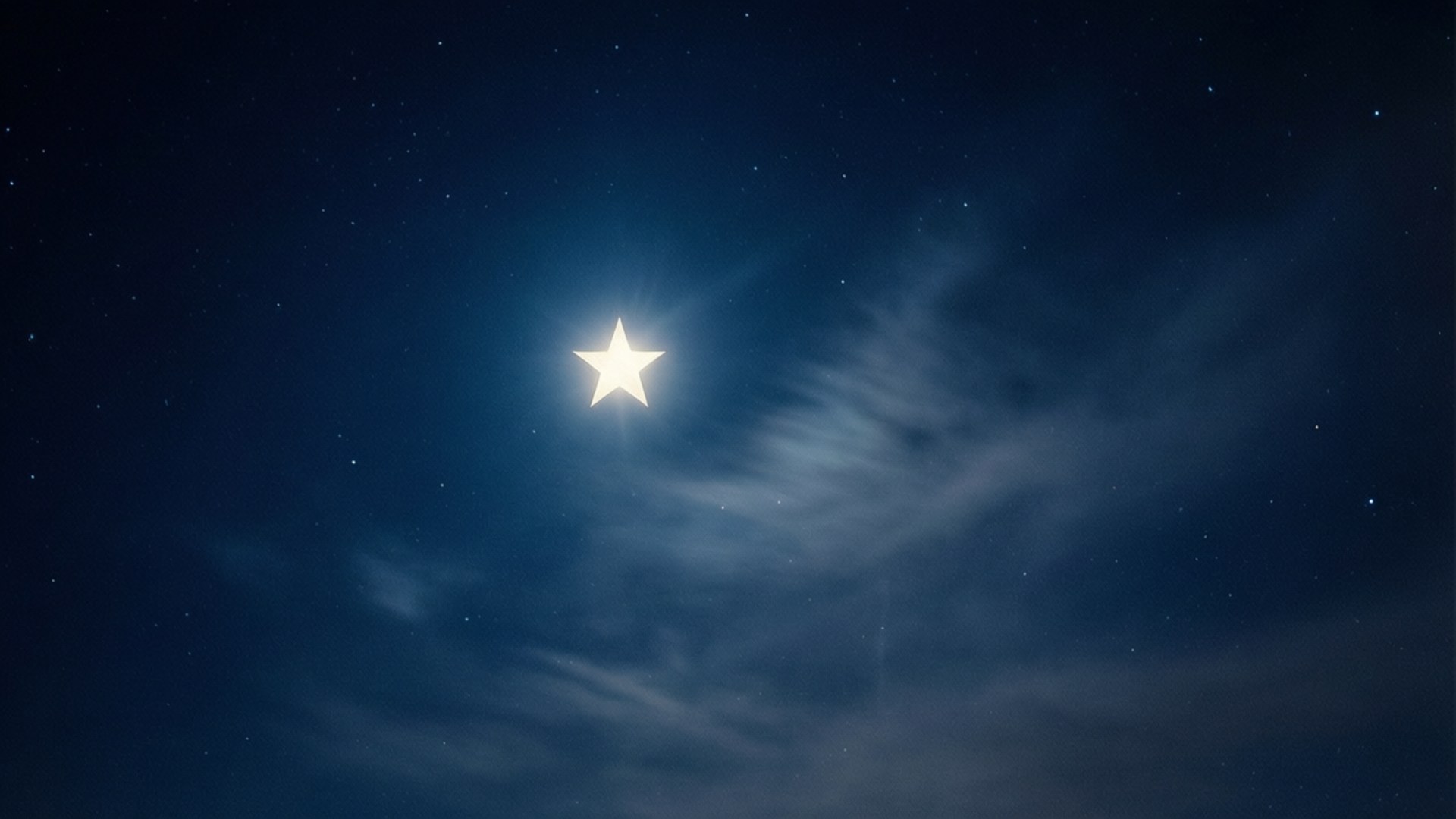 Lone Star Brilliance 壁紙 — 一顆光芒四射的五角星在深藍色的夜空中閃耀，夜空中有縷縷薄雲和散落的星星。