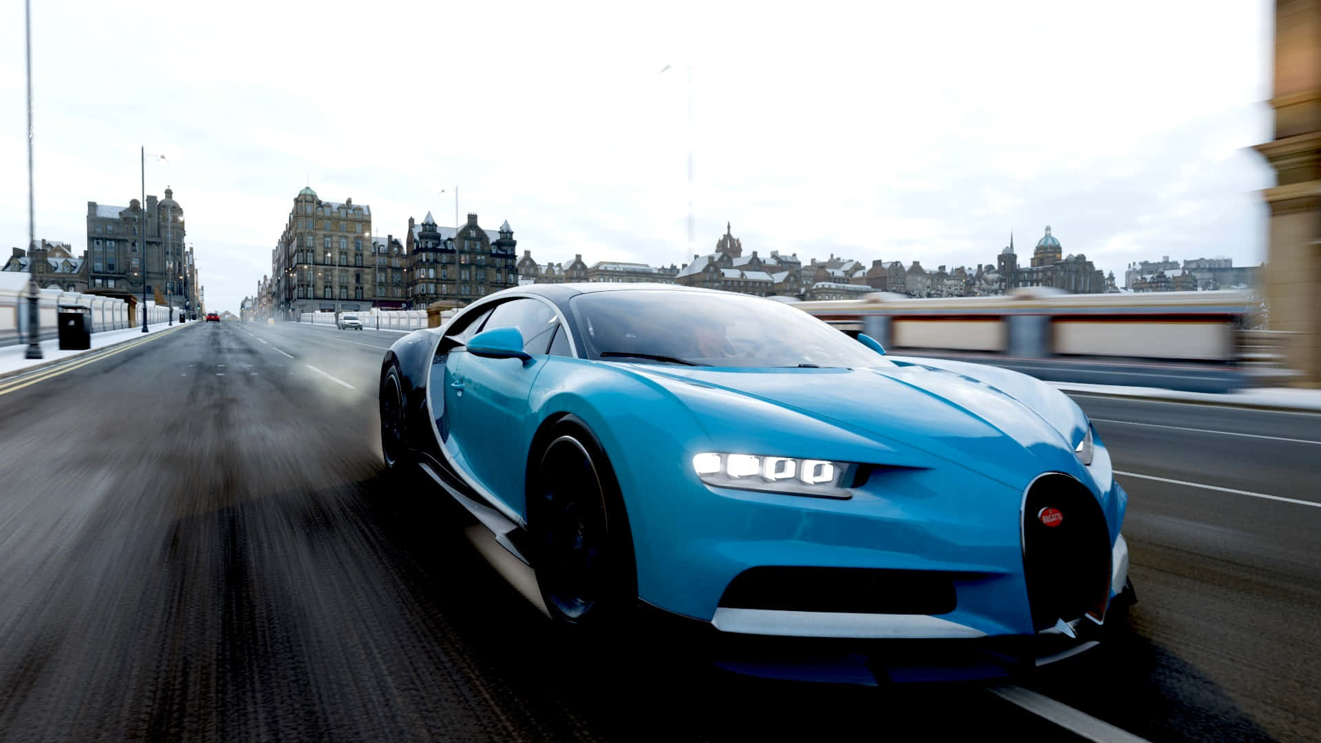 Bugatti Chiron 桌布 壁紙 — 一輛充滿活力的藍色布加迪Chiron在雪景城市橋樑上飛馳，背景是歷史建築。