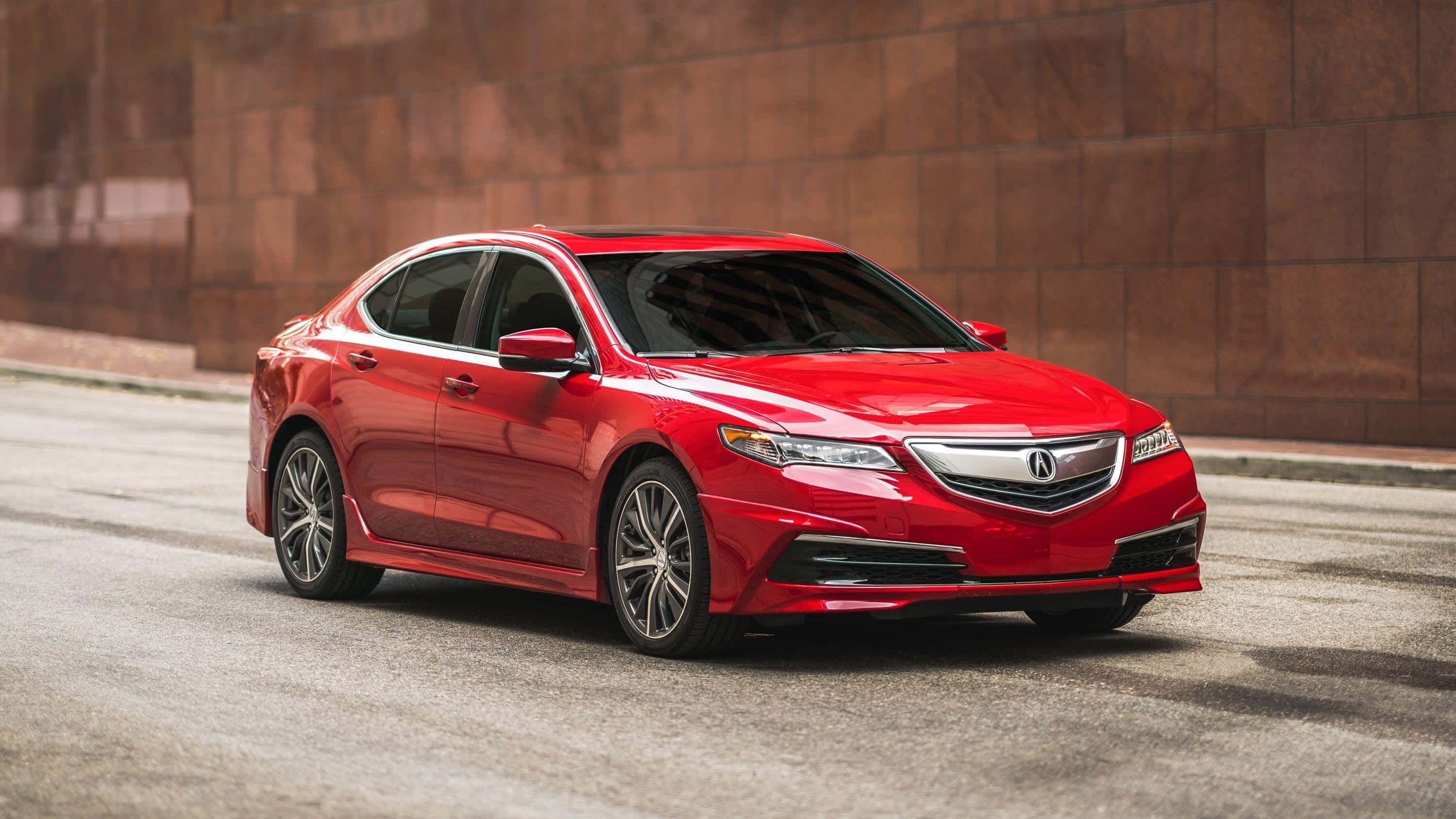 Acura Tlx 桌布 壁紙 — 一輛光澤的紅色Acura轎車停放在城市的街道上，旁邊是帶紋理的棕色磚牆。
