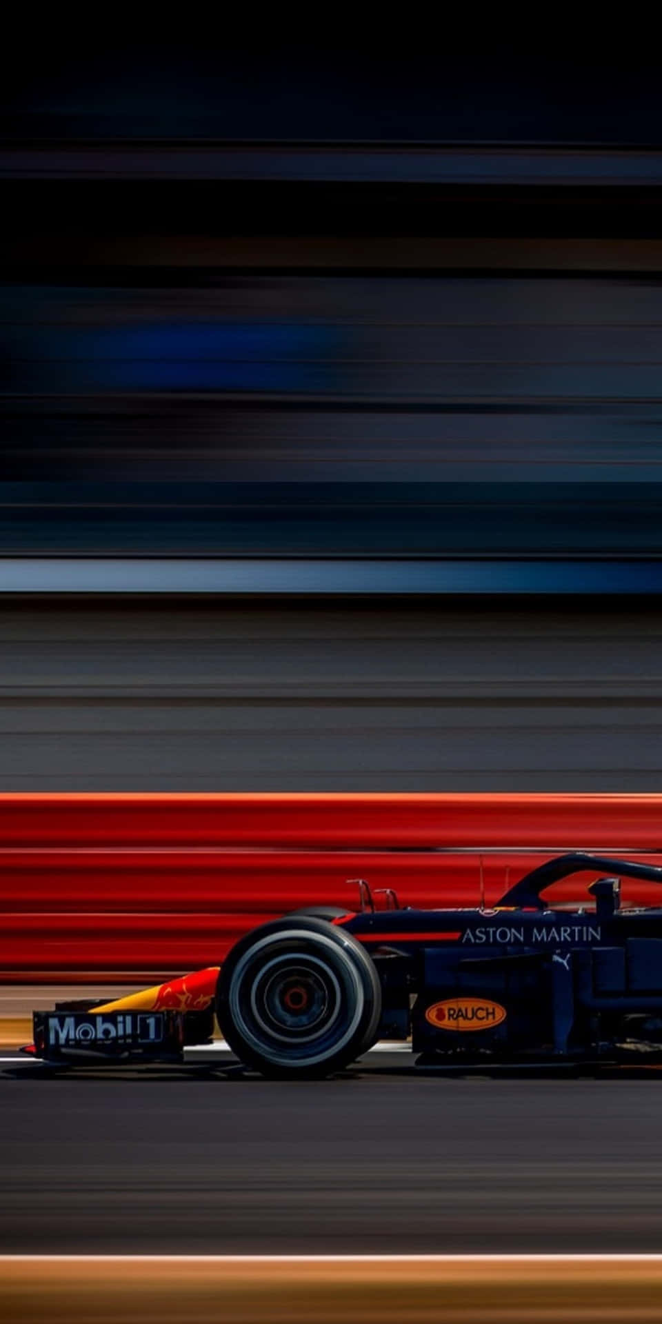 一輛藍色F1賽車在賽道上疾馳，帶有動態模糊的痕跡。 — F1 壁紙