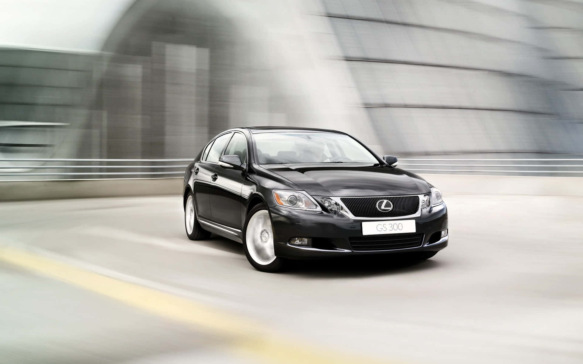 Lexus Gs 桌布 壁紙 — 一輛時尚的黑色Lexus GS 300沿著現代混凝土高架橋疾馳，動態模糊強調速度。