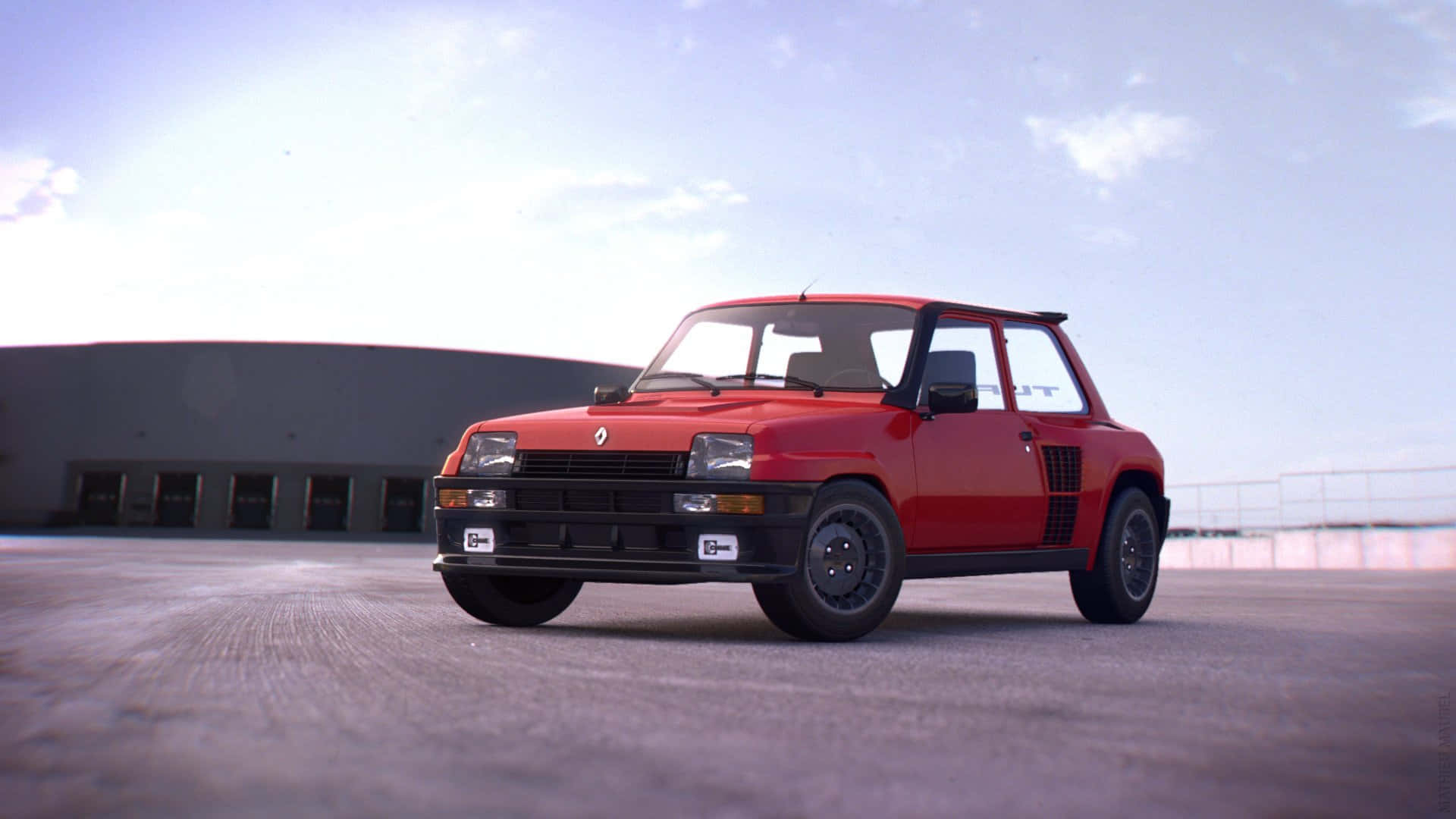 Renault 5 Turbo 桌布 壁紙 — 一輛鮮紅色的雷諾5 Turbo停放在混凝土場地上，背景是帶有散雲的柔和藍天。