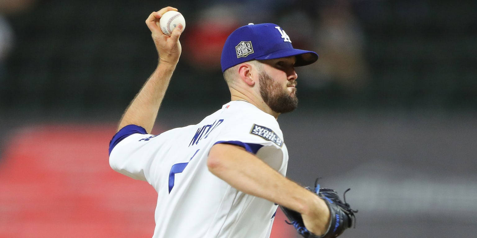 棒球投手在世界大賽夜間比賽中投球中。 — MLB 壁紙