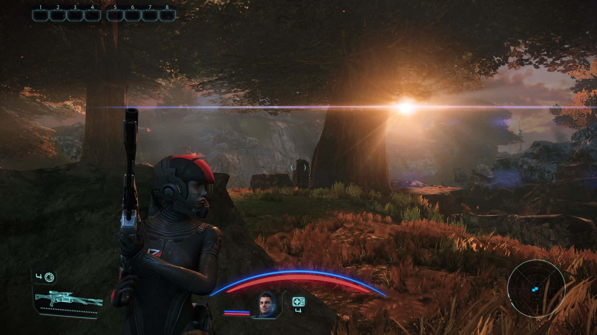 Mass Effect Legendary Edition 桌布 壁紙 — 一名身穿暗色盔甲的未來士兵在黃昏時分的陽光森林中站立，手持帶有發光HUD元素的步槍。
