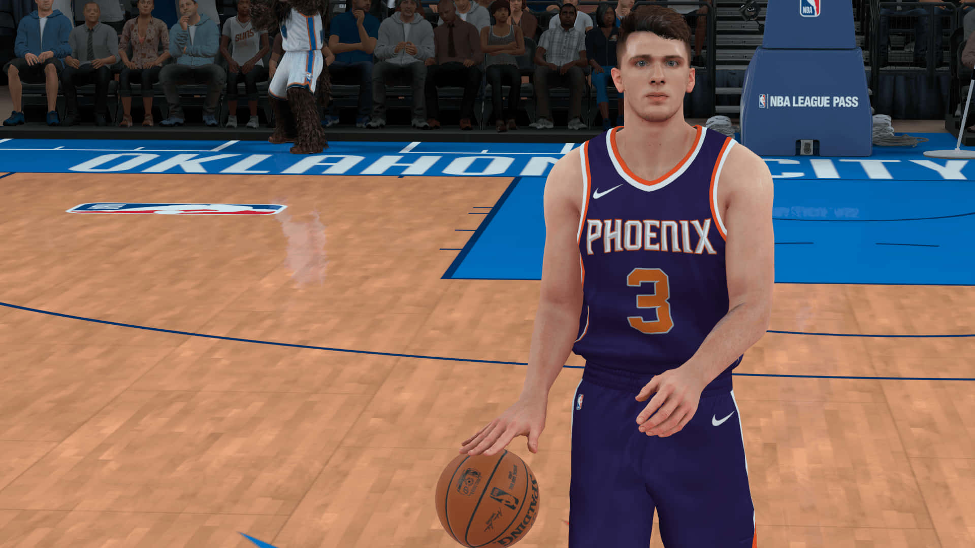 身穿鳳凰城太陽隊球衣的籃球運動員在球場上持球。 — NBA 壁紙