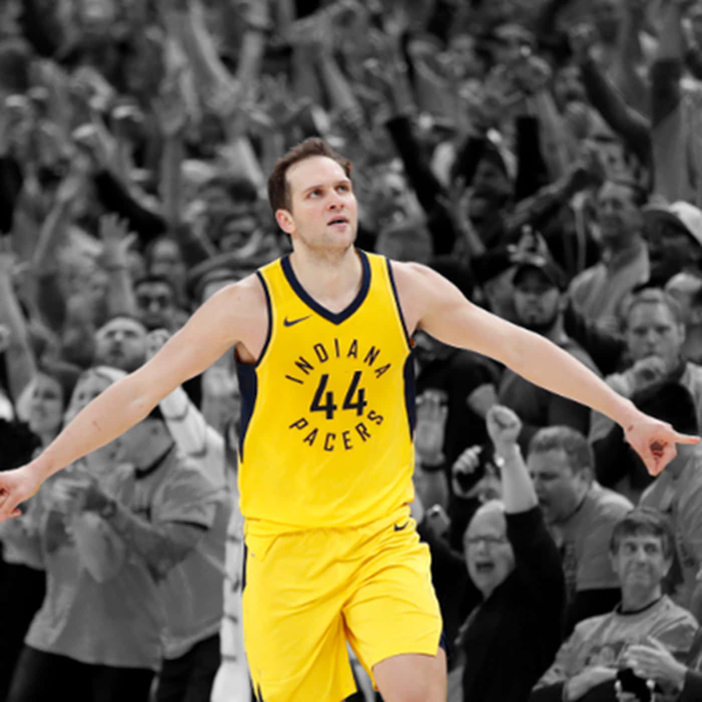 身穿黃色溜馬隊球衣的籃球運動員張開雙臂慶祝。 — NBA 壁紙