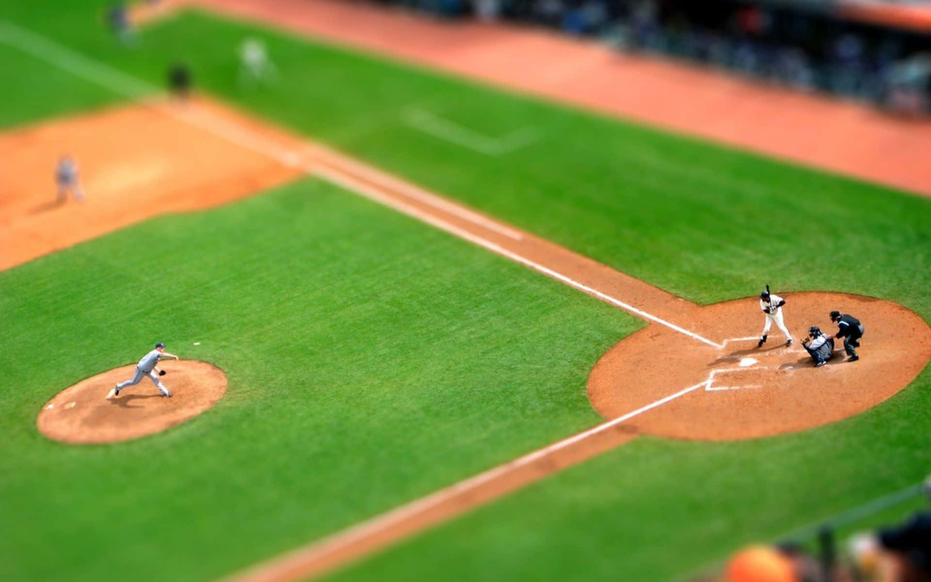 微型棒球比賽，投手、打者、捕手和外野手對焦清晰。 — MLB 壁紙