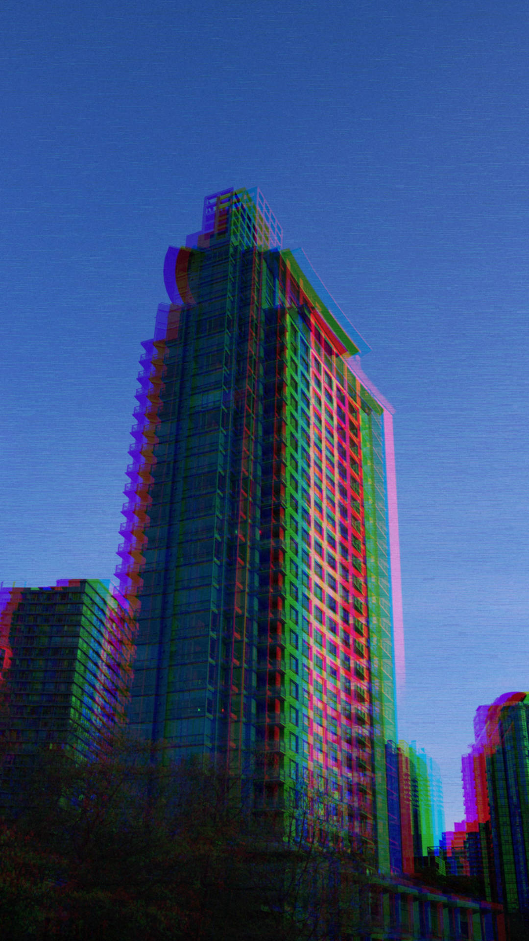 夜晚城市中色彩繽紛的故障摩天大樓 — Lofi 壁紙
