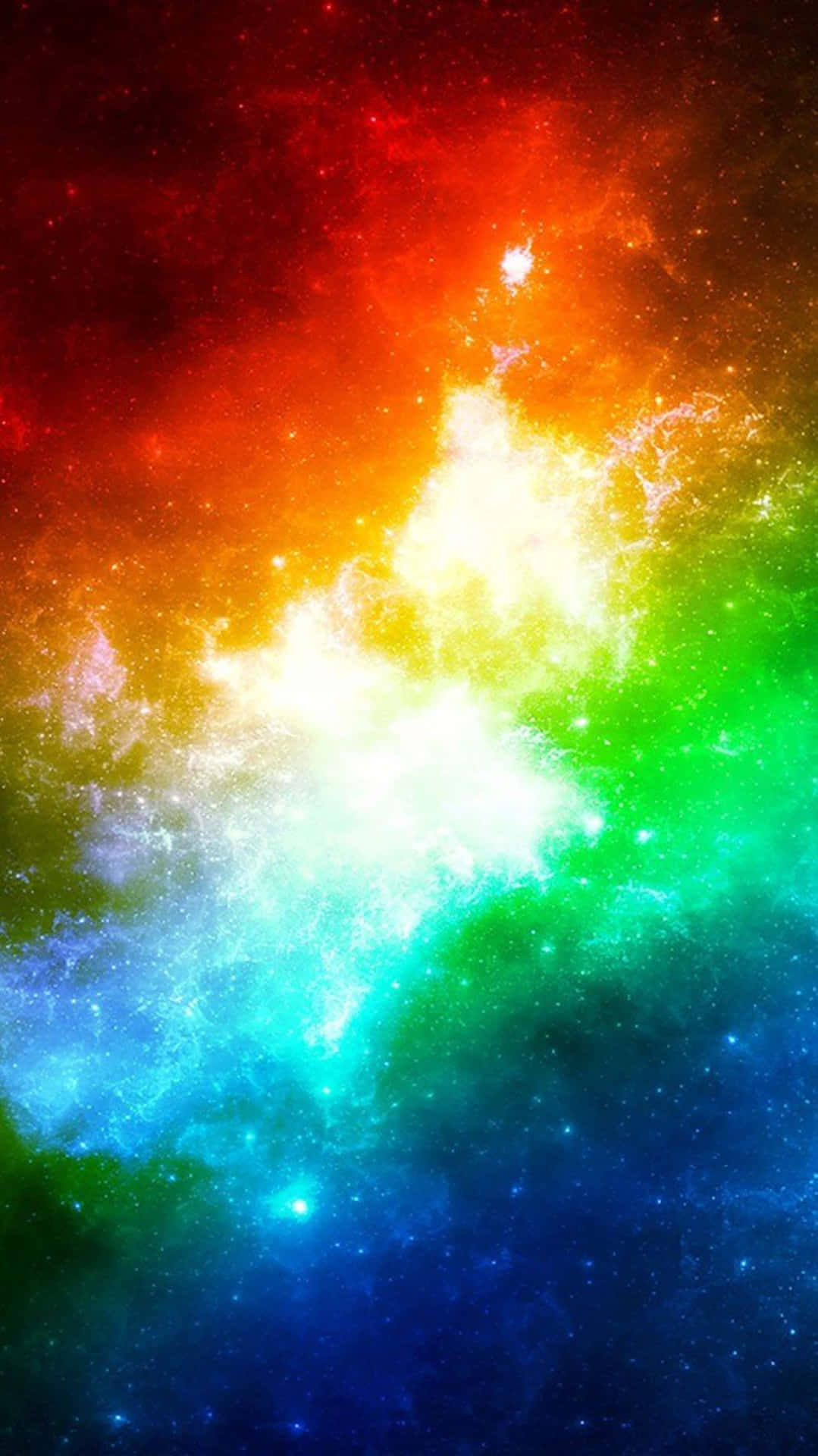  壁紙 — 一個充滿活力的宇宙星雲在繁星點點的虛空中爆發，呈現紅、橙、黃、綠、藍、紫的彩虹色調。